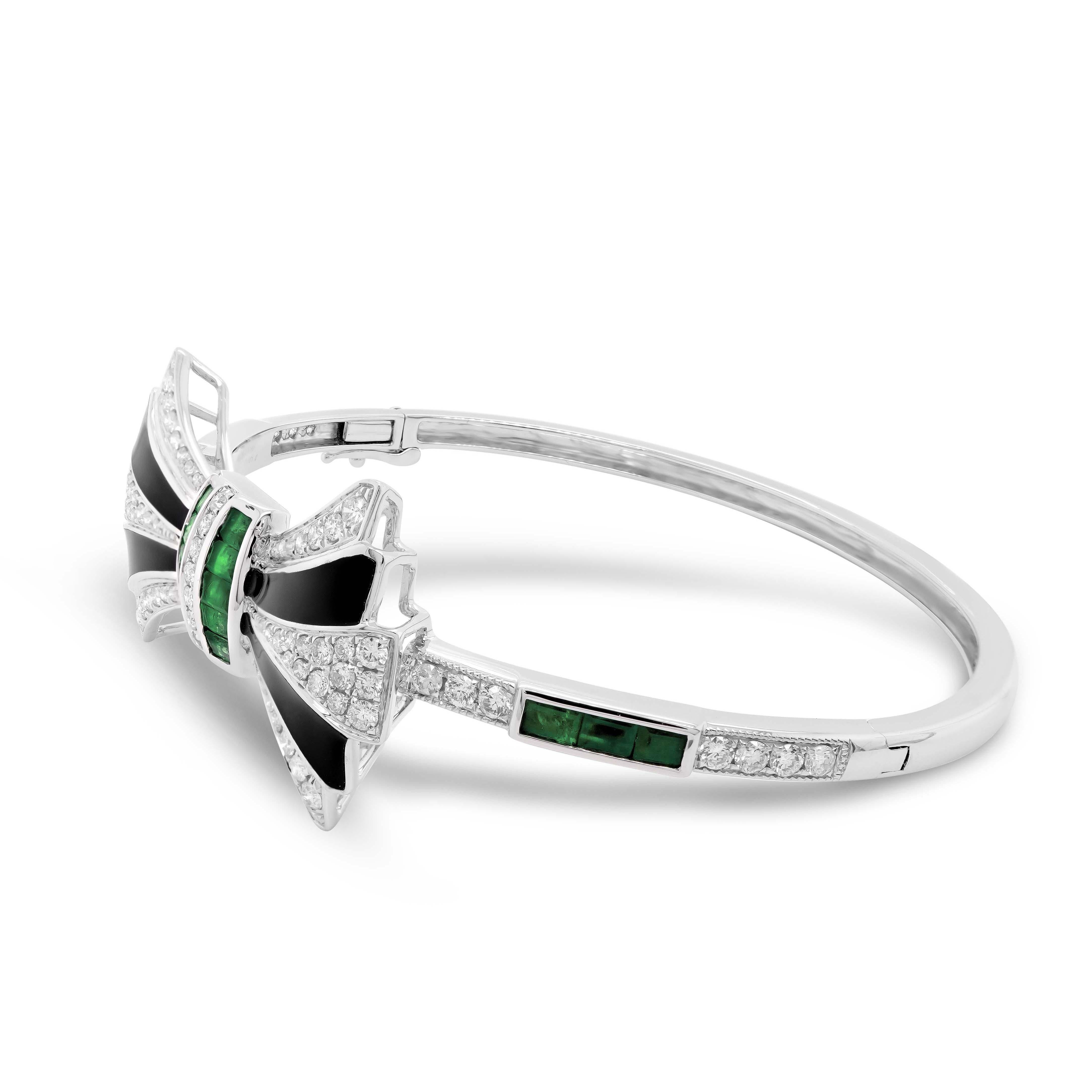 This beautiful statement bangle comprises 4pcs of irregular cut, 0.55ct black onyx stones from Tucson America, and 16pcs of baguette emeralds from Zambia. The bangle is complimented well with 83 brilliant white diamonds, adding an extra touch of