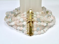 18k bracelet, 8 strands of morganite and aquamarine with Dragonfly clasp