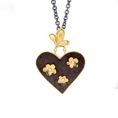 18k Butterfly and Flower Heart Necklace with Rusted Iron and Sterling Silver