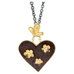 keith haring necklace 18k Butterfly and Flower Heart Necklace with Rusted Iron and Sterling Silver