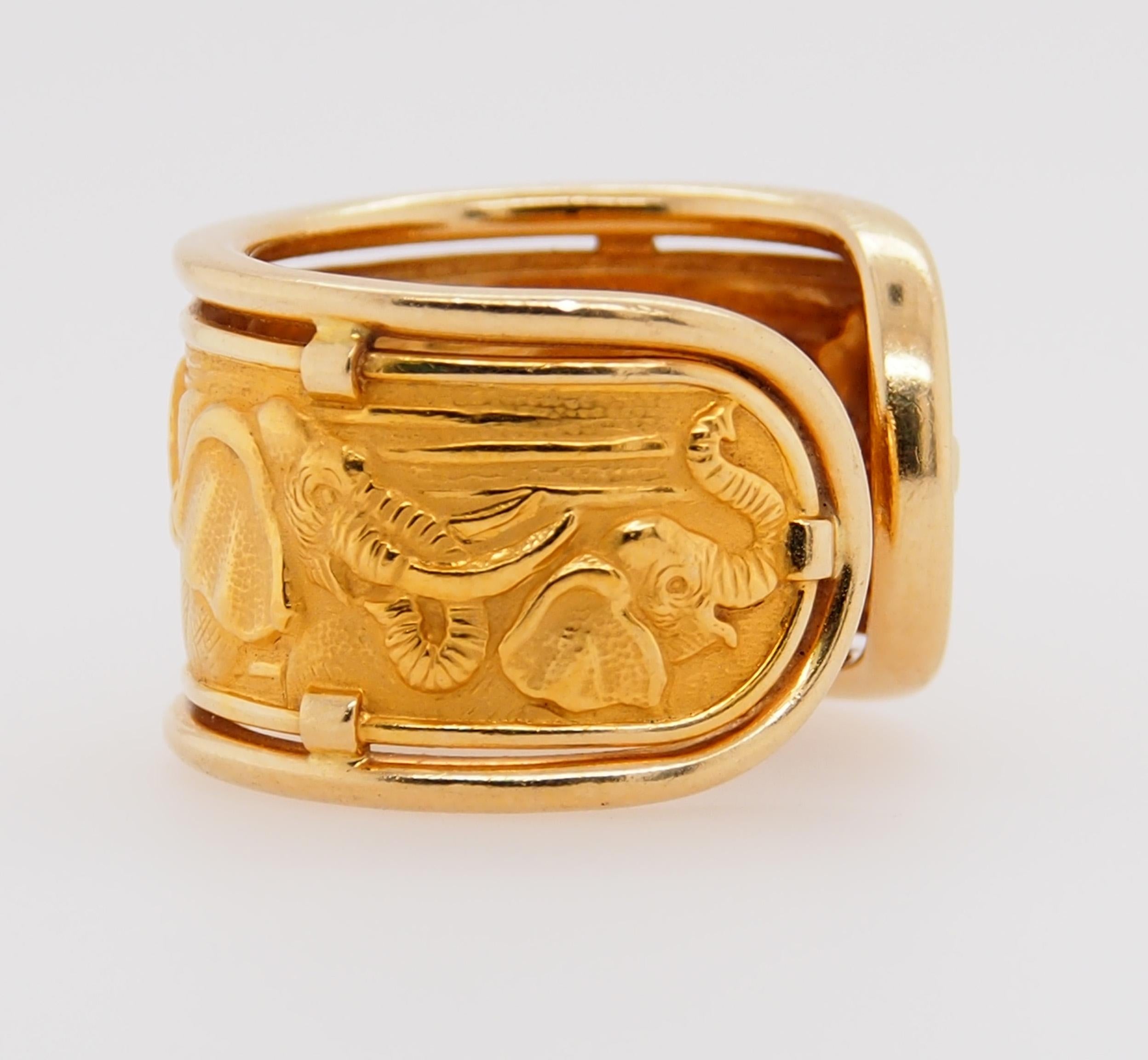Carrera y Carrera 18K Yellow Gold engraved Elephant Band.  Approximately 1/2 inch wide, open back, finger size 7.  Weighs 6.84 grams.