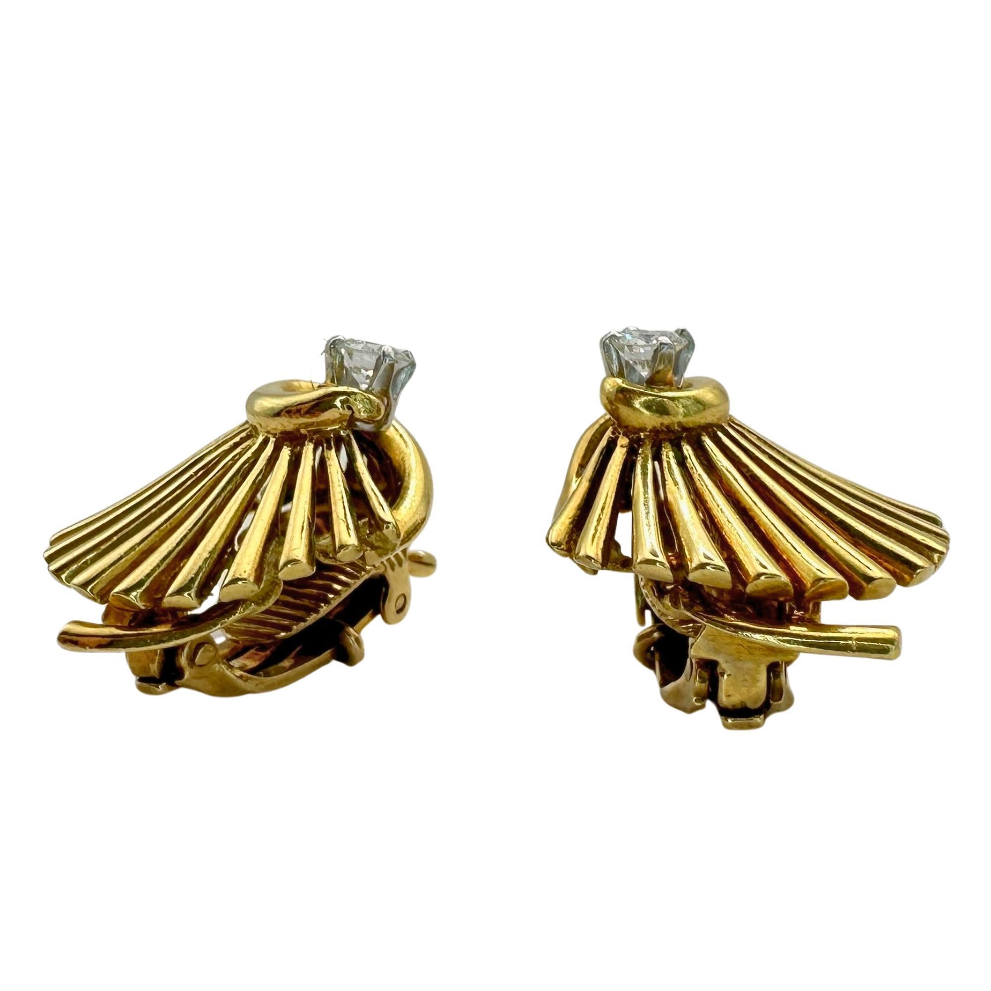 Make a statement with these stunning 18k Cartier Diamond Ear Clips from the 1940's. In excellent condition with minor surface wear, these clips add a touch of elegance to any outfit. Featuring 0.50 carats of sparkling diamonds and marked with the