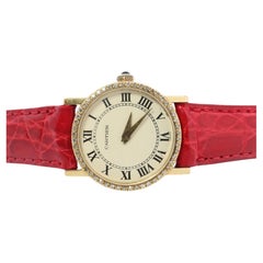 18k Cartier Diamantuhr. 18k YG Cartier x Baume Mercier Runde Damenuhr.
