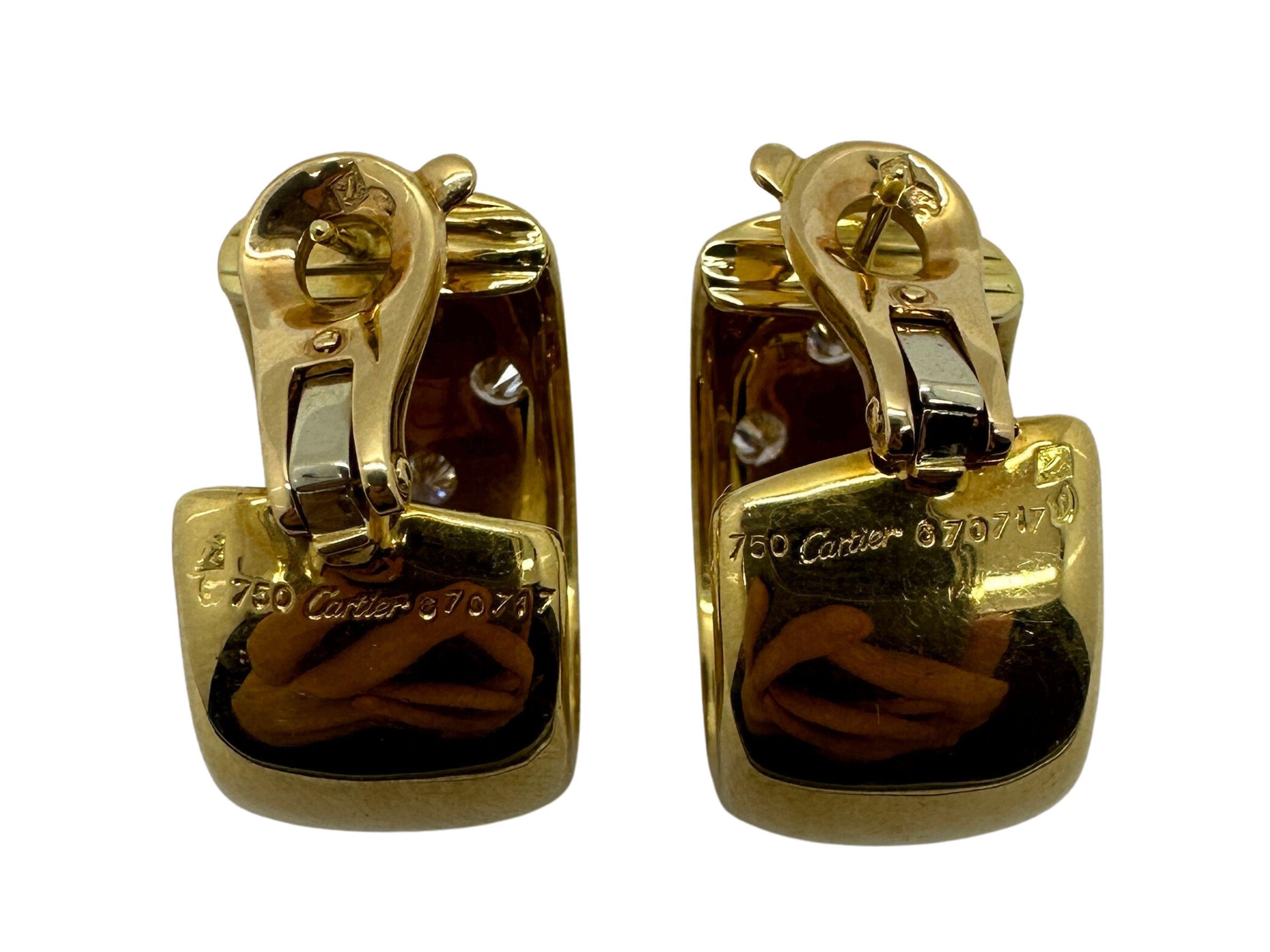 Gönnen Sie sich die ikonische Eleganz von Cartier mit diesen atemberaubenden Estate Gold- und Diamant-Reifen. Diese Ohrringe sind in gutem Zustand mit geringen altersbedingten Abnutzungserscheinungen und zeugen von Cartiers zeitlosem Design.

Diese