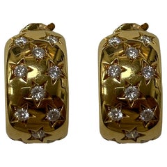18 Karat Cartier Estate Gold- und Diamant-Creolen mit Sternmotiv aus Gold.