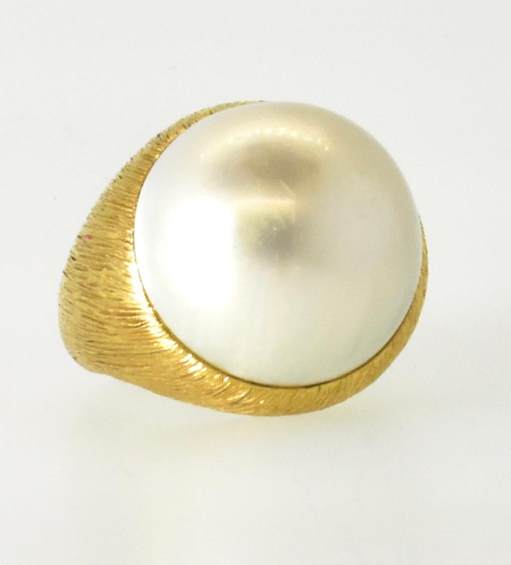 18K centering a Very Fine Large over 19 mm Mabe Cultured Pearl Ring  circa 1960. 5