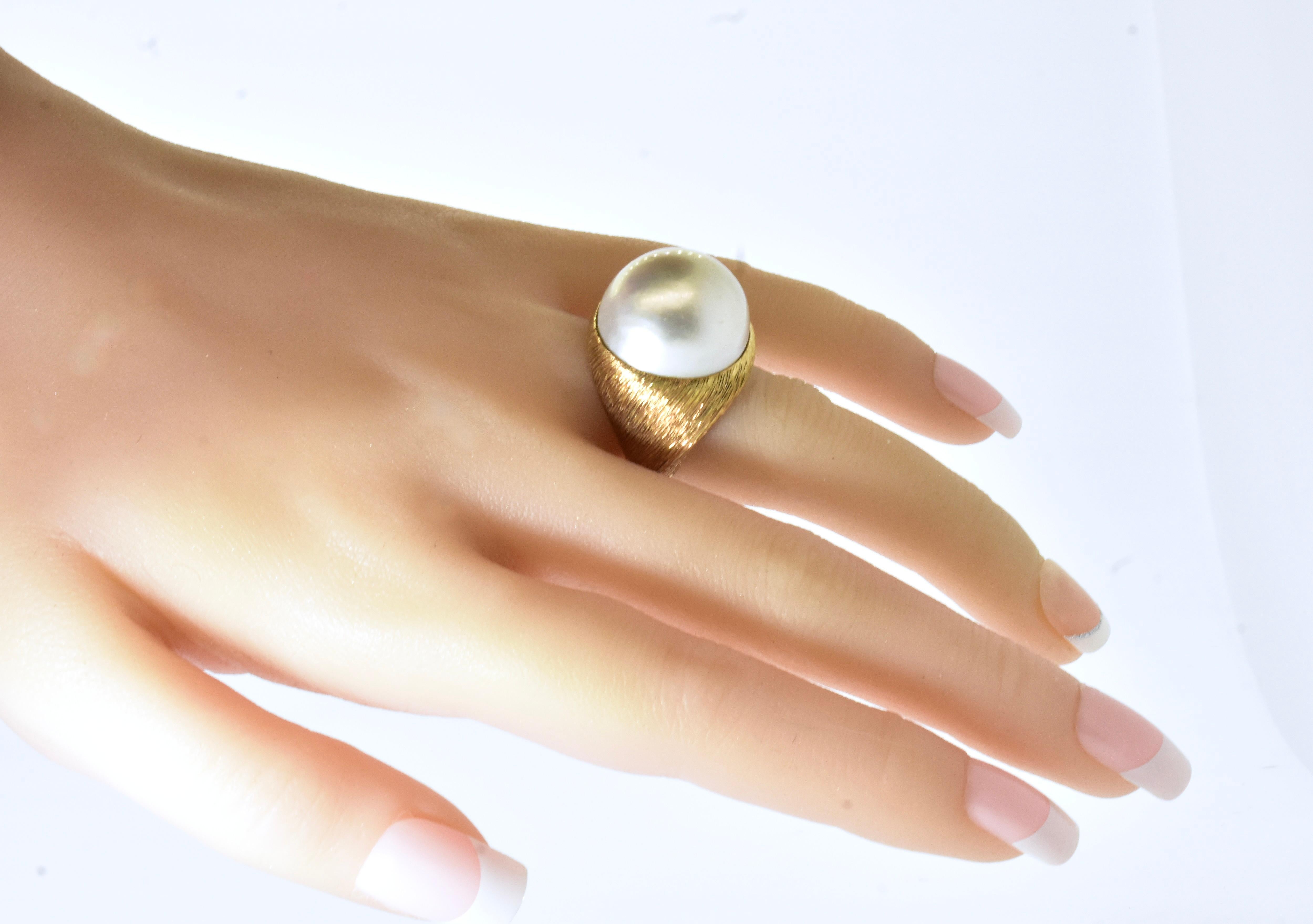 Bead 18K centering a Very Fine Large over 19 mm Mabe Cultured Pearl Ring  circa 1960.