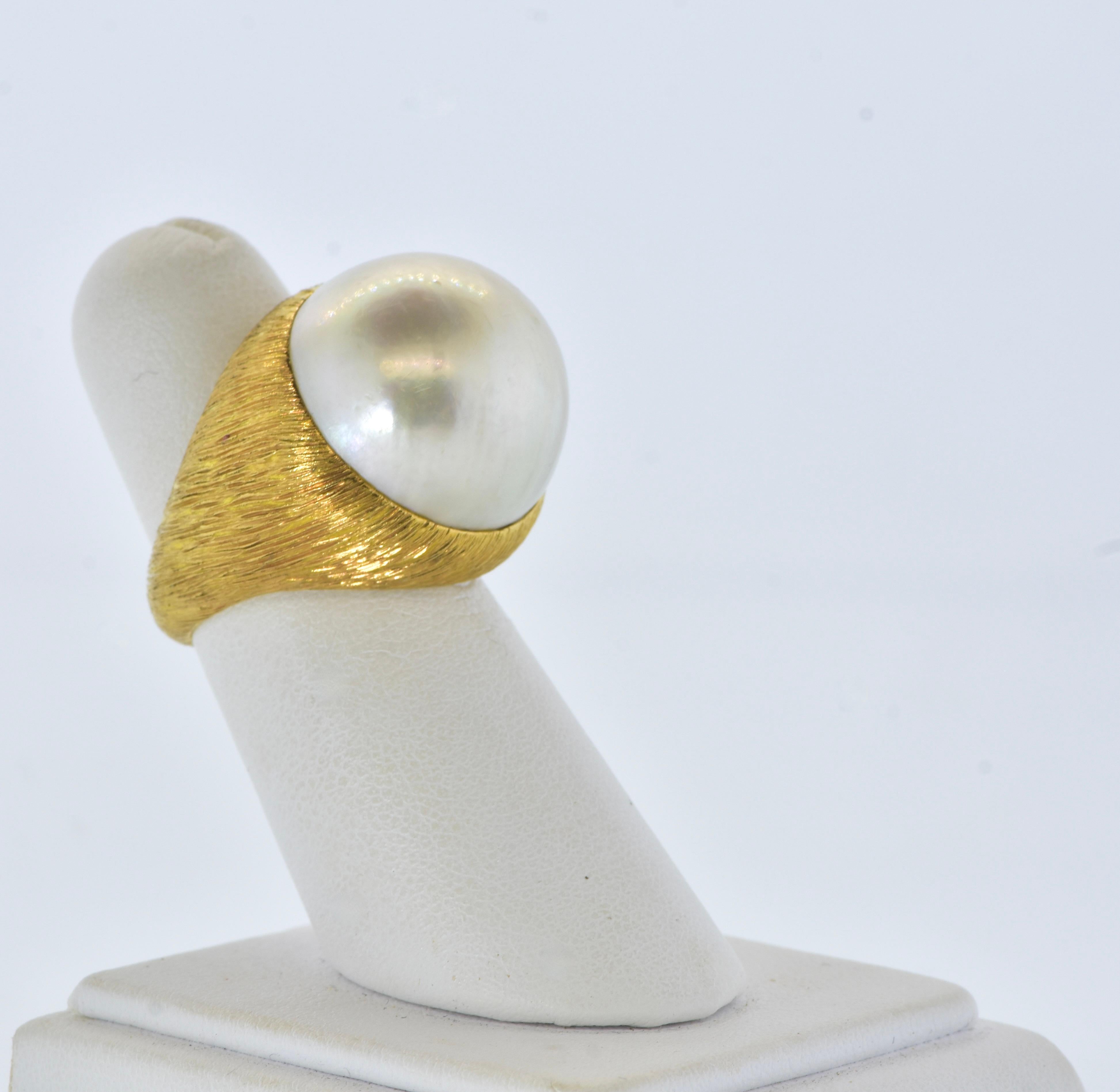 18K centering a Very Fine Large over 19 mm Mabe Cultured Pearl Ring  circa 1960. 1