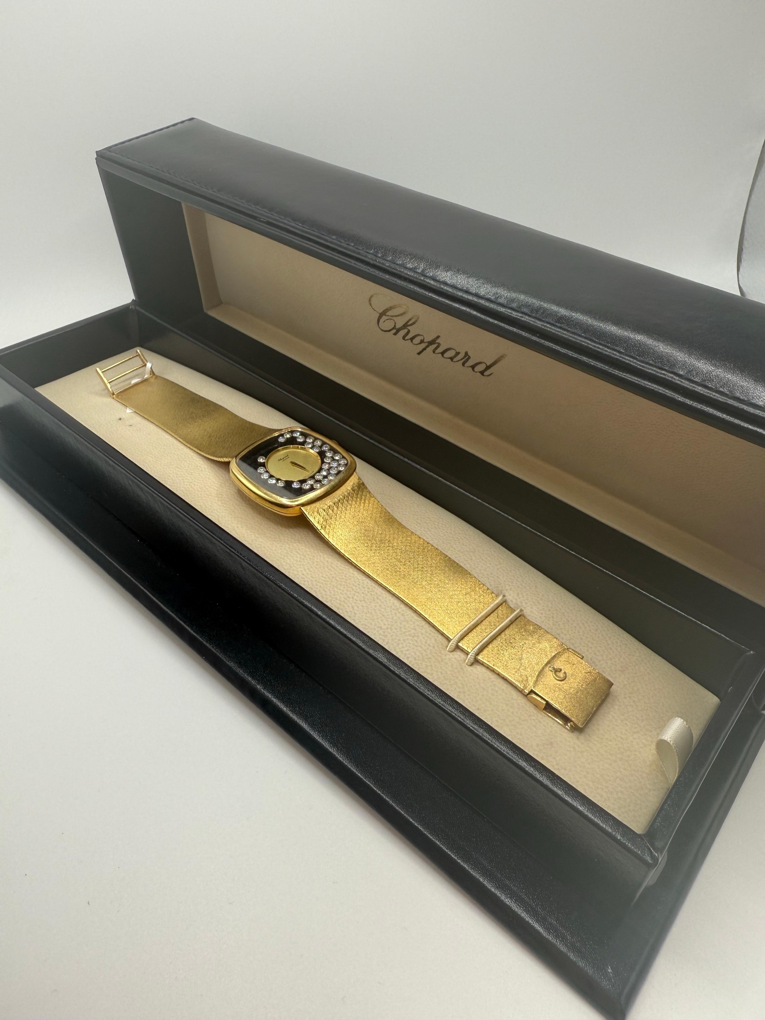 This elegant vintage Chopard timepiece combines timeless design with refined luxury. The watch features a square case crafted in solid 18k yellow gold, paired with a finely textured gold bracelet that flows seamlessly into the case for a sleek,