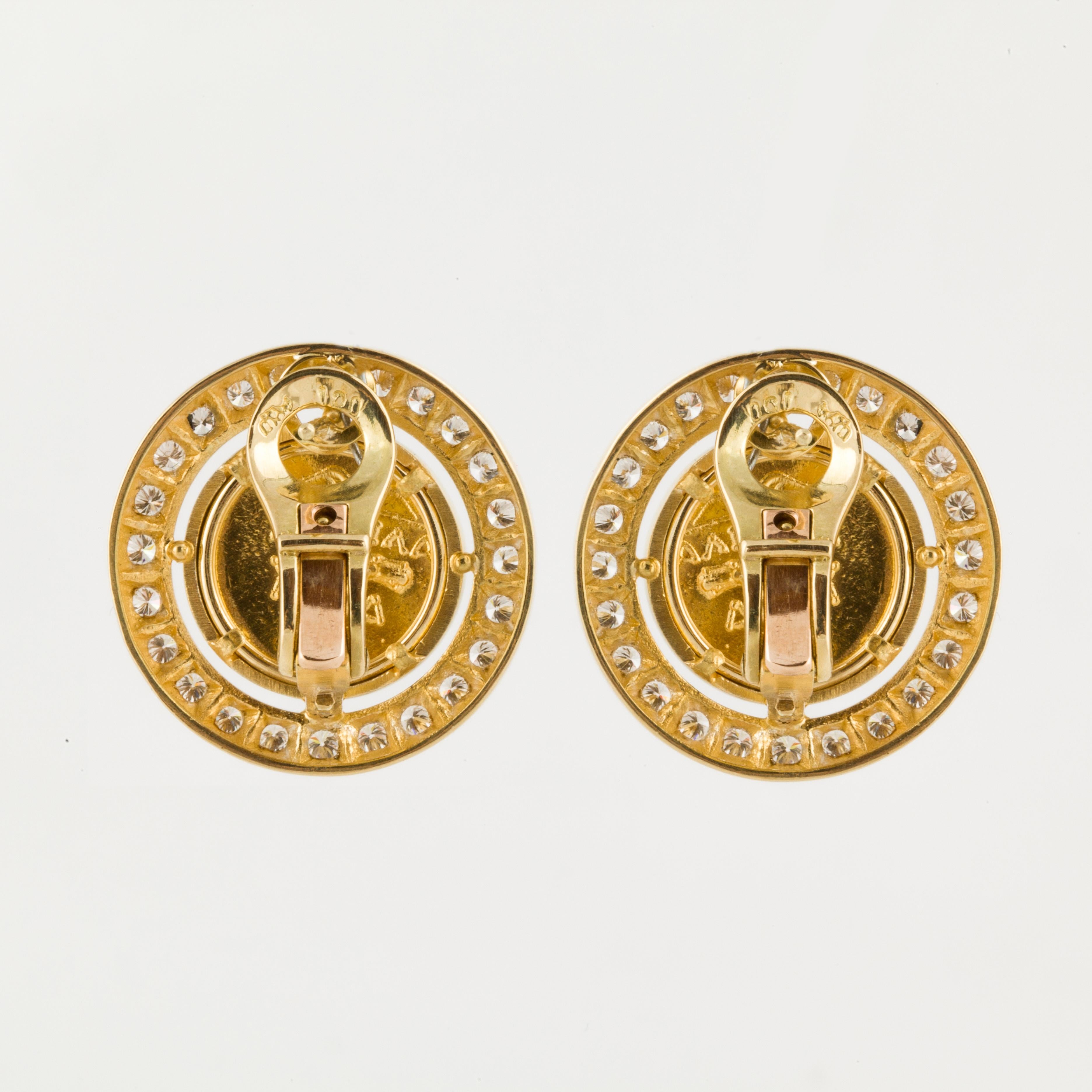 18K yellow gold earrings with replica coins framed with round diamonds.  There are a total of 48 round diamonds weighing 1.45 carats; G-H color and VS clarity.  Measure 7/8 inches in diameter.  For pierced ears with a lever back.