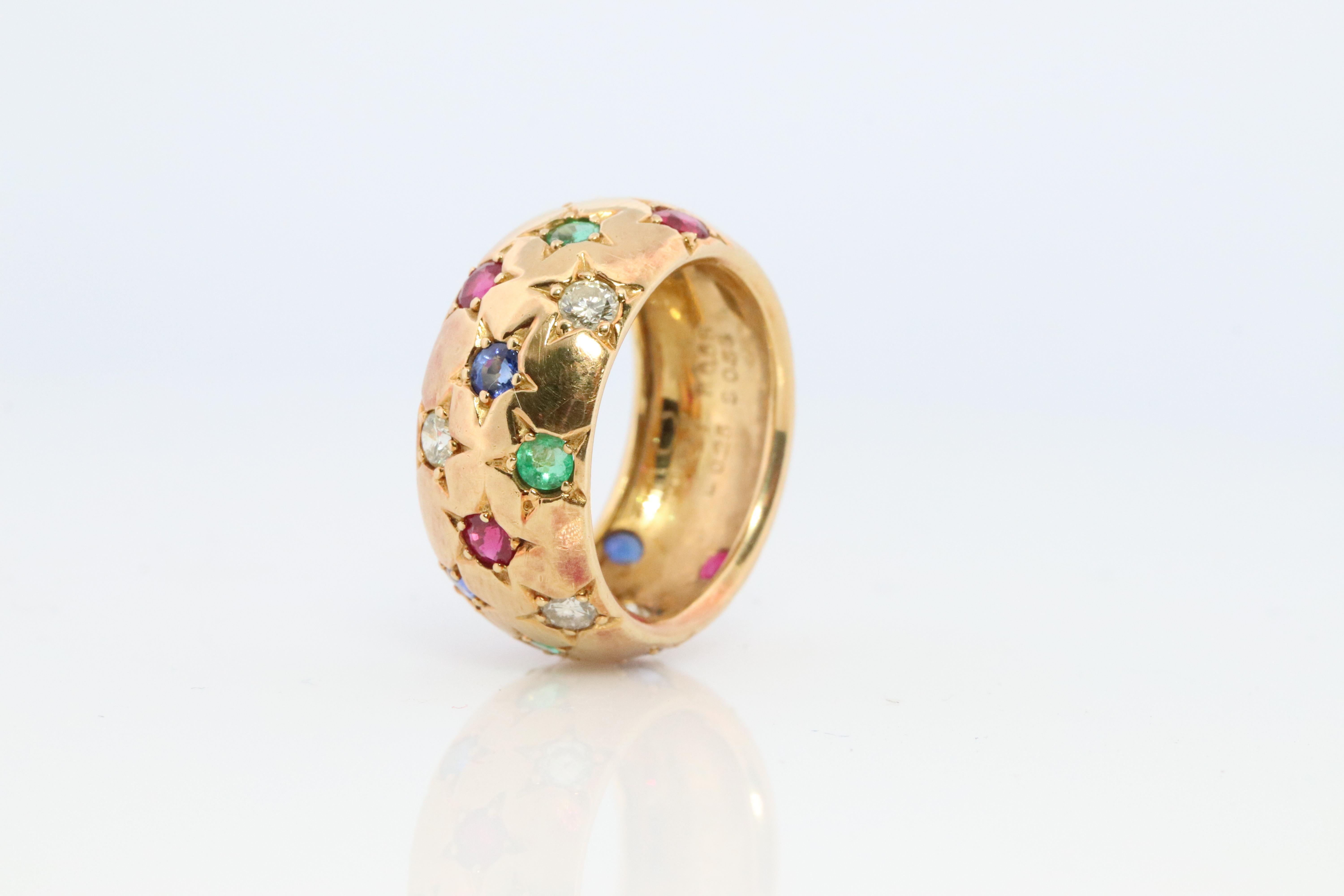 It will be hard to find another one like this.

Confetti Gem Star Gypsy Bezel set  Band.

Wide Cigar Band.

18k Yellow Gold
0.31ctw diamonds
0.65ct Natural Ruby
0.53ct Natural Sapphire
0.25 Natural Emerald


Condition: Shows little to no visible