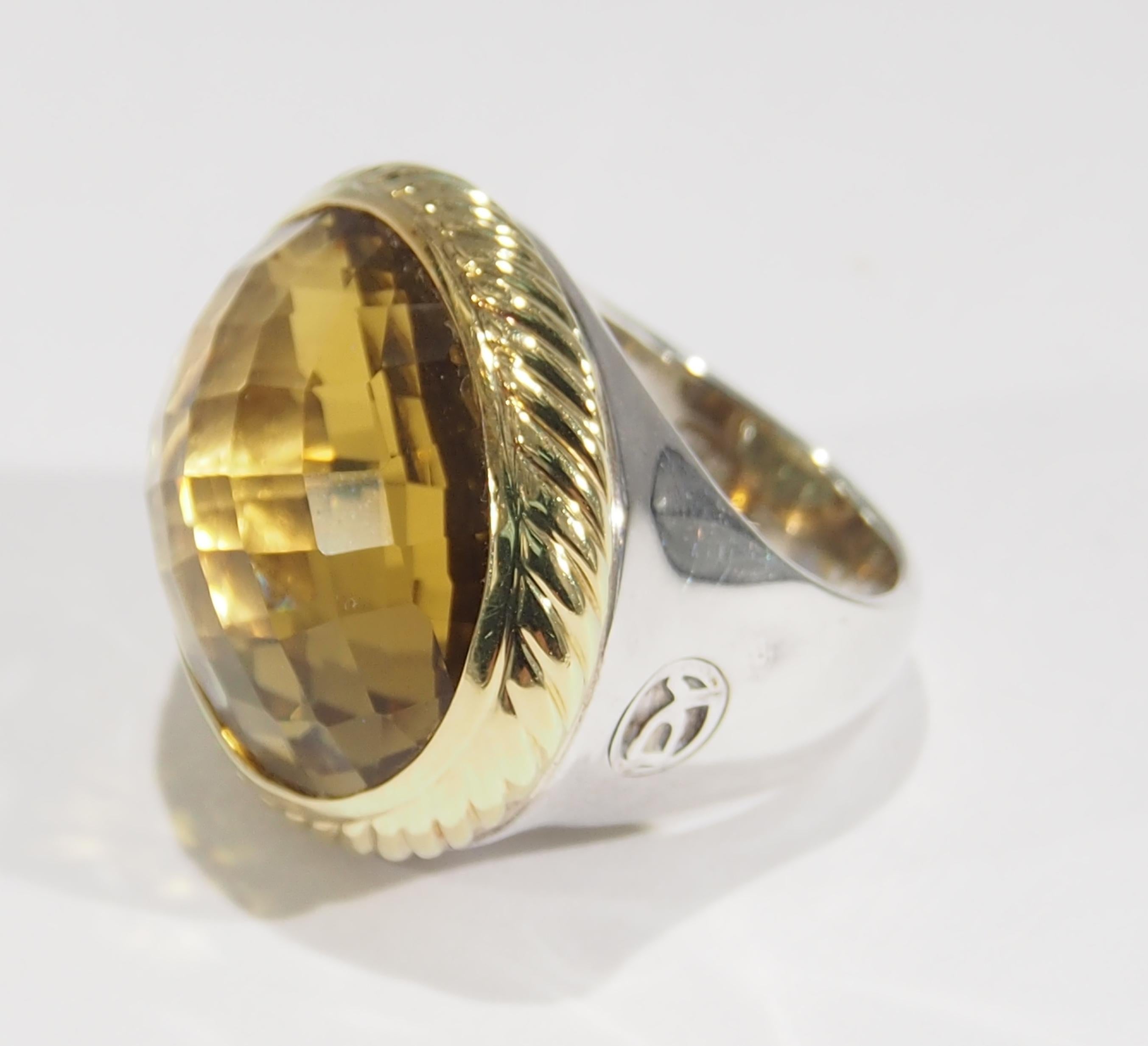 From one of America's favorite jewelry designers, David Yurman is this Sterling Silver with 18K Yellow Gold Ring. His Albion Collection style Ring has a faceted 24x20mm Oval Citrine set in an 18K Yellow Gold Bezel. Truly a statement Ring as the