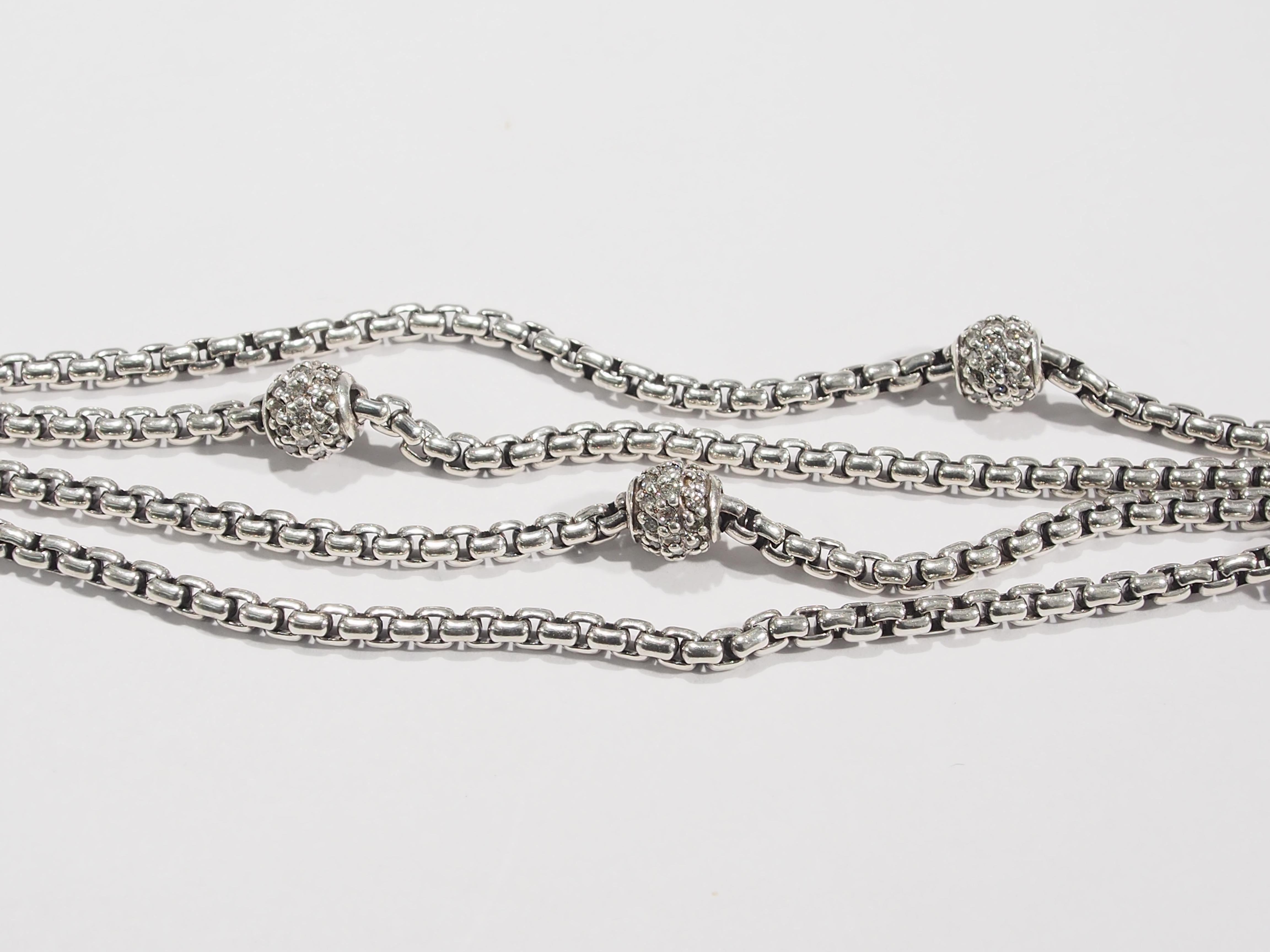 From one of America's favorite jewelry designer, David Yurman is a stunning multi-strand Bracelet. The Bracelet has 4 Strands of his signature Sterling Silver Box Link Chain accented with 5 Pave' Beads sparkling with 165 Round Brilliant Cut