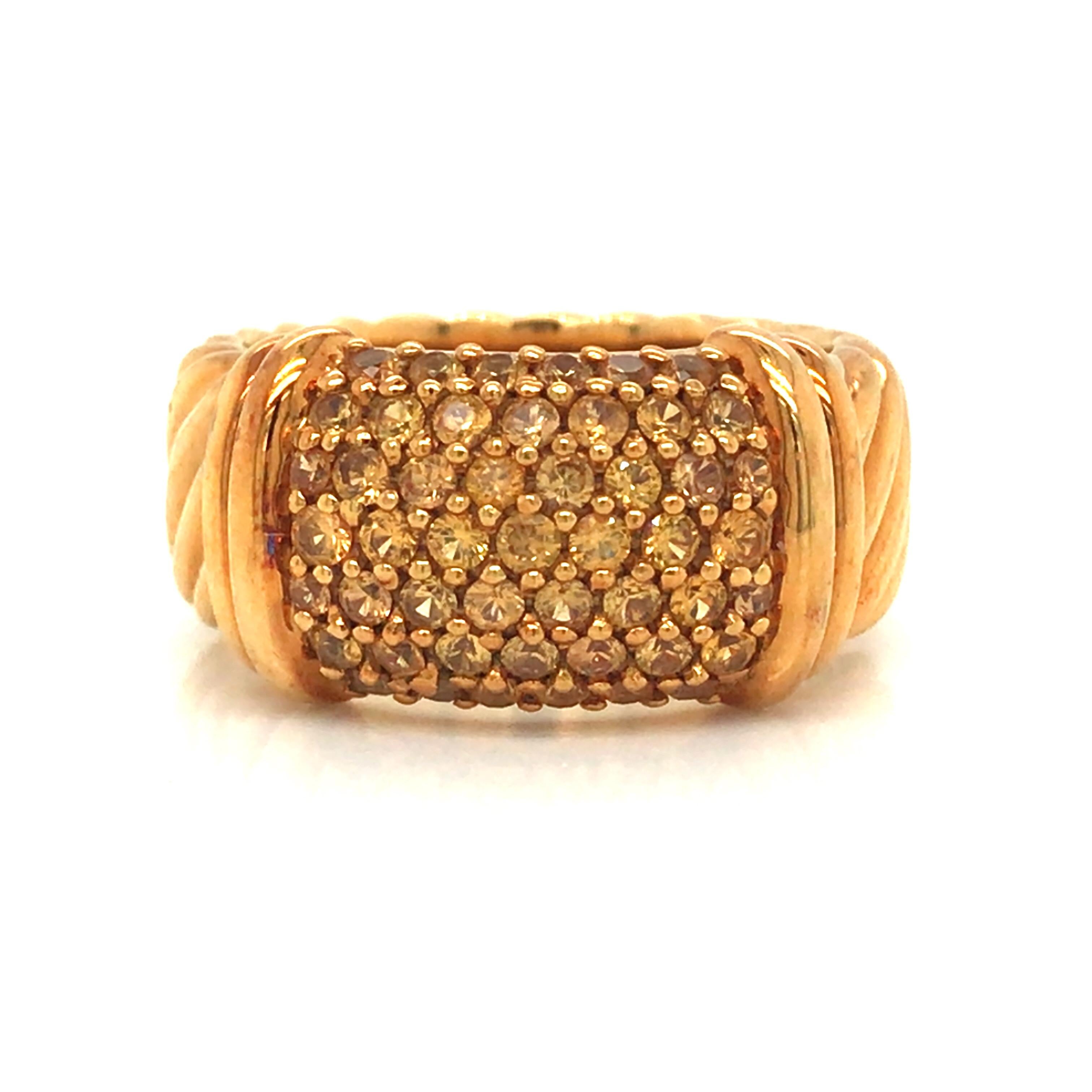 David Yurman Yellow Sapphire Band in 18K Yellow Gold.  Yellow Sapphires weighing 1.0 carat total weight are expertly set.  The Ring measures 3/8 inch in width. Ring size 6. 11.9 grams.  Signed.