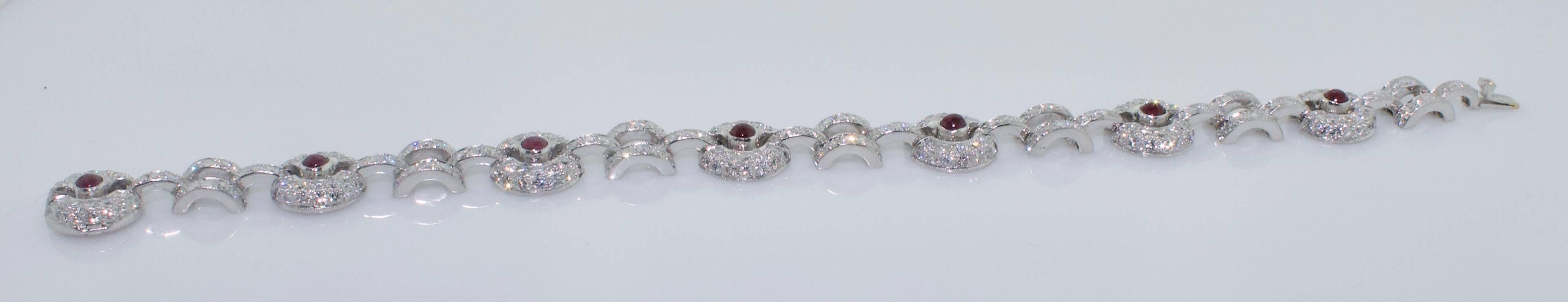 Cabochon Ruby and Diamond Bracelet
Seven Cabochon Cut Rubies weighing 1.00 carats approximately (Red and Bright)
Three Hundred and Sixty Four Round Brilliant Cut Diamonds weighing 7.50 carats approximately (GH VS-SI)
