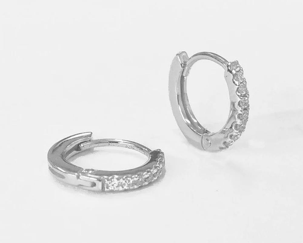 Diamond Hoop Earrings is made of 18K solid gold available in three colors of gold, White Gold / Rose Gold / Yellow Gold.

Natural diamond huggies earrings set in 18K Gold. Dainty earrings perfect by itself or paired with other earrings. perfect to