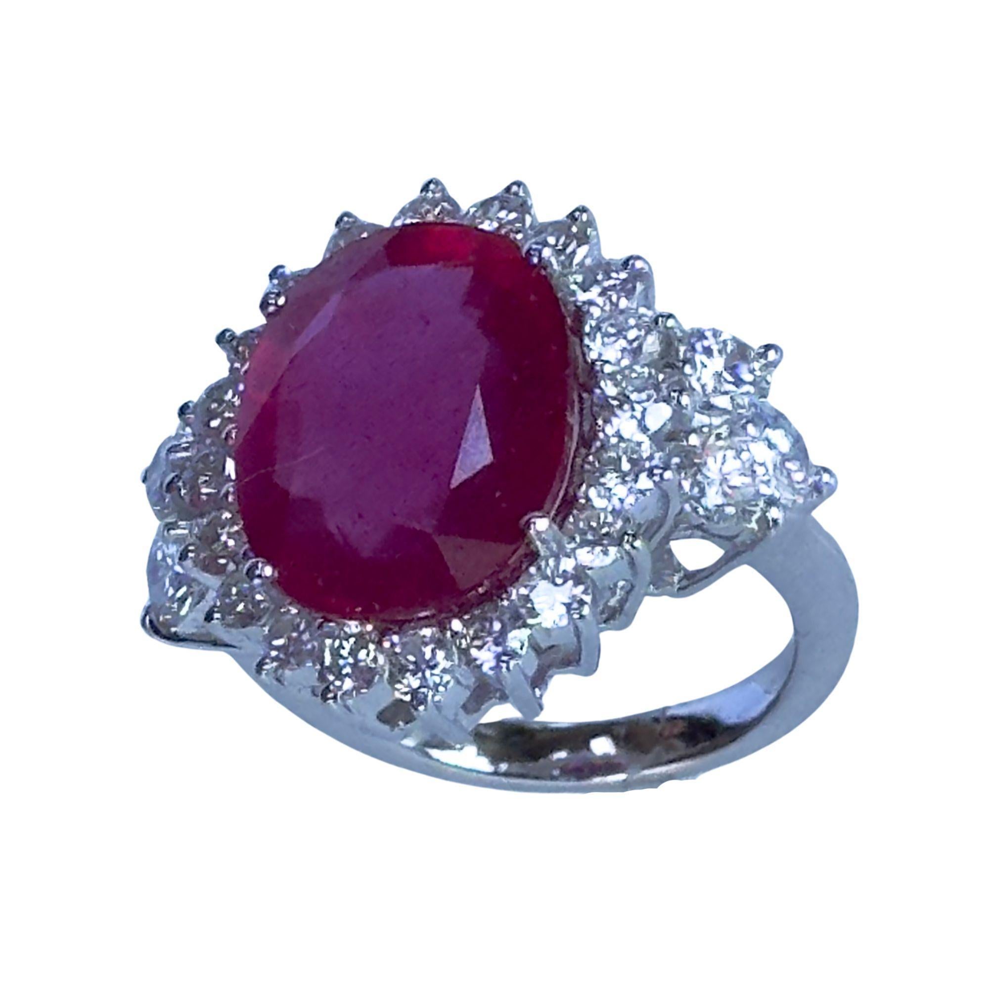 This stunning 18k diamond and ruby ring features a total of 2.66 carats of diamonds and a beautiful 10.14 carat ruby center, all set in 18k white gold. With its elegant design, solid weight of 8.65 grams, and ring size of 6.75, it is the perfect