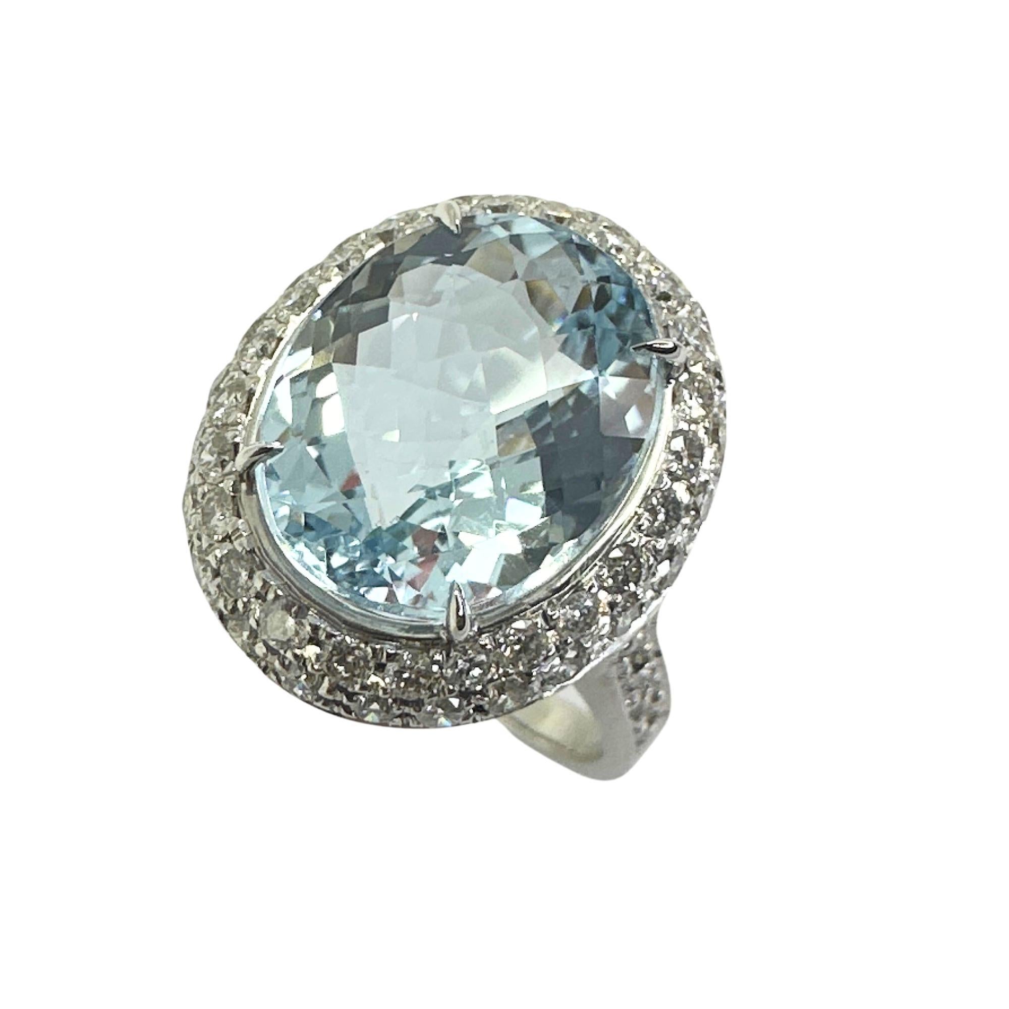 Indulge in this exquisite 18k Diamond and Aquamarine Ring! The sparkling 1.00 carat diamonds and dazzling 5.15 carat aquamarine radiate luxury and elegance. Crafted in 18k white gold and only weighing 7.3 grams, this ring offers a lightweight and