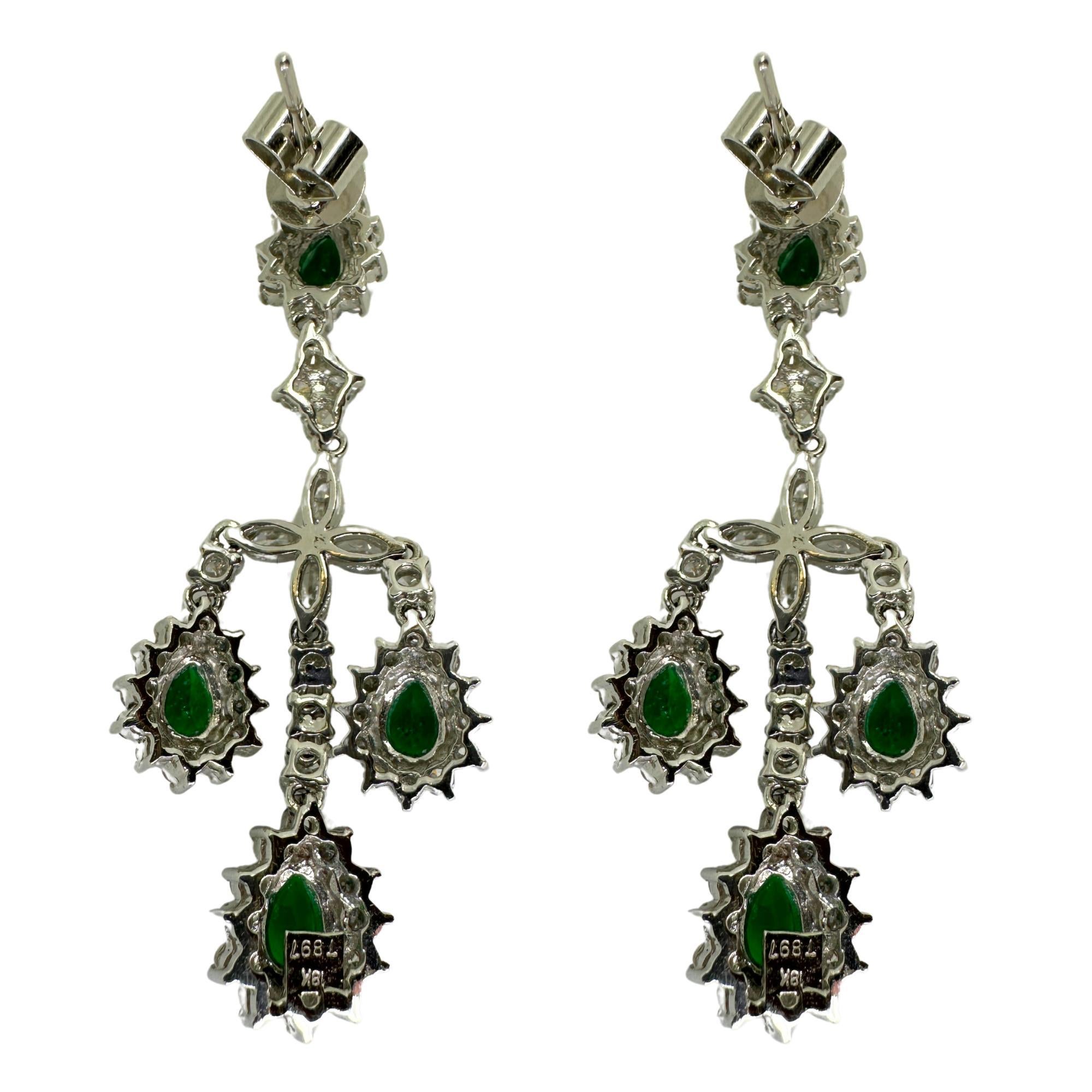 Indulge in the exquisite beauty and opulence of our 18k diamond and emerald earrings. Crafted with 2.95 carats of dazzling diamonds and 2.08 carats of mesmerizing emeralds, these earrings are a symbol of timeless elegance. Made of 18k white gold and