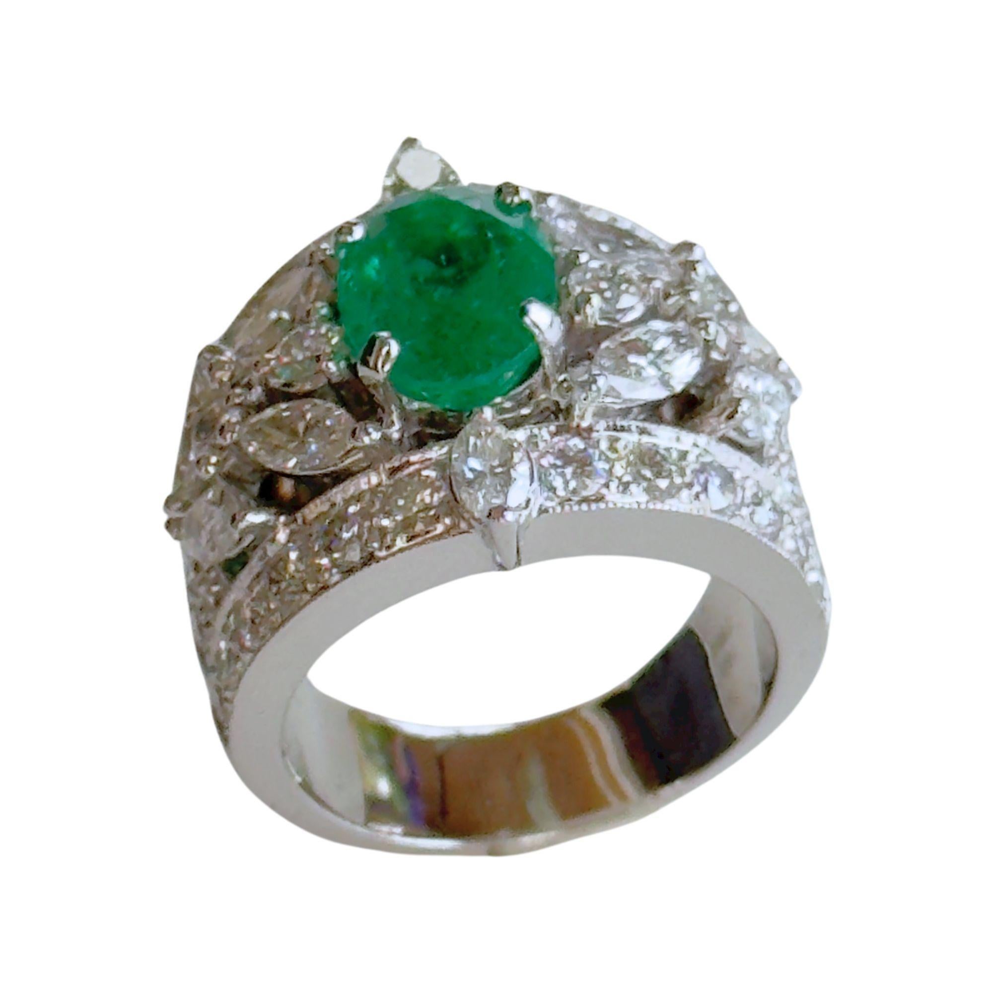 18k White Diamond and Emerald Ring. Expertly crafted with a remarkable balance of luxury and elegance, this 18k white Diamond and emerald ring features dazzling 3.7 carats of diamonds and a stunning 2.95 carat emerald. Its substantial 12.2 gram