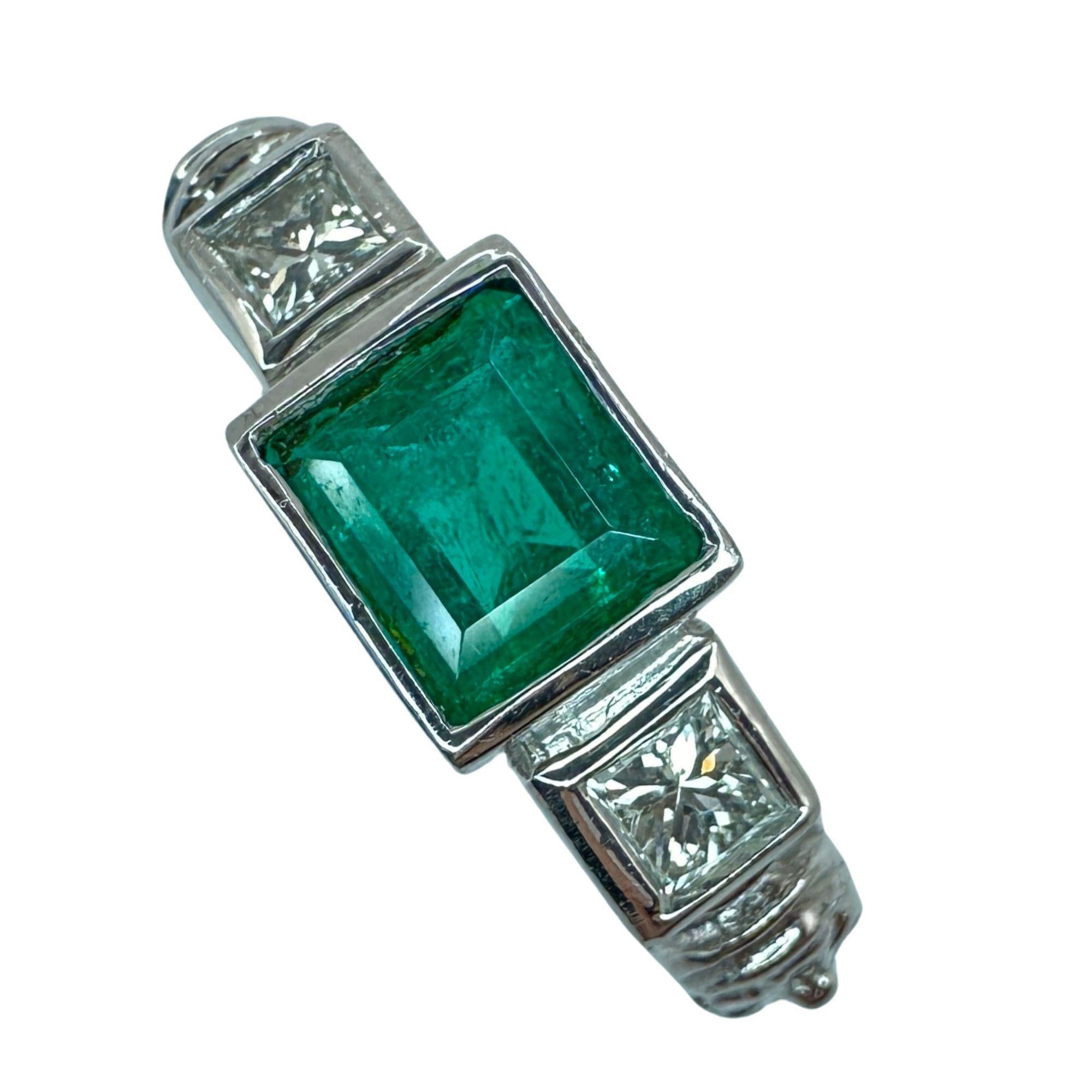 This 18k diamond and emerald ring is perfect for everyday wear.It weighs 6.88 grams and is a size 6.75. The center emerald weighs 0.70 carats and is accompanied by two side diamonds weighing a total of 0.28 carats, providing a subtle yet elegant
