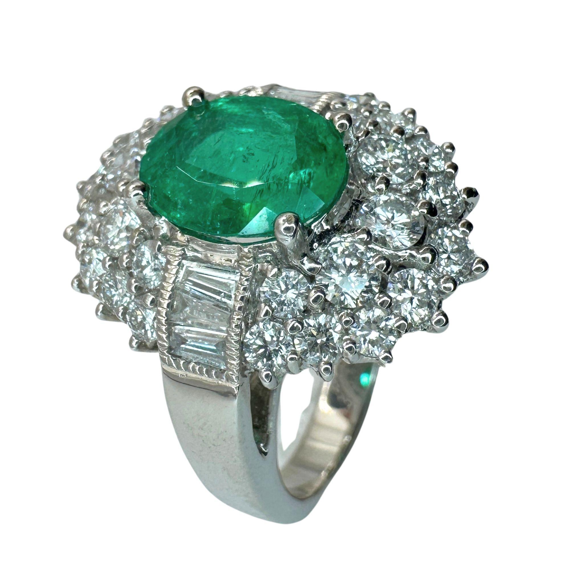 Indulge in the ultimate luxury with our 18k Diamond and Emerald Ring. Crafted from white gold and adorned with 1.55 carats of sparkling diamonds and a stunning 1.71 carat emerald center, this ring exudes elegance and sophistication. With a ring size