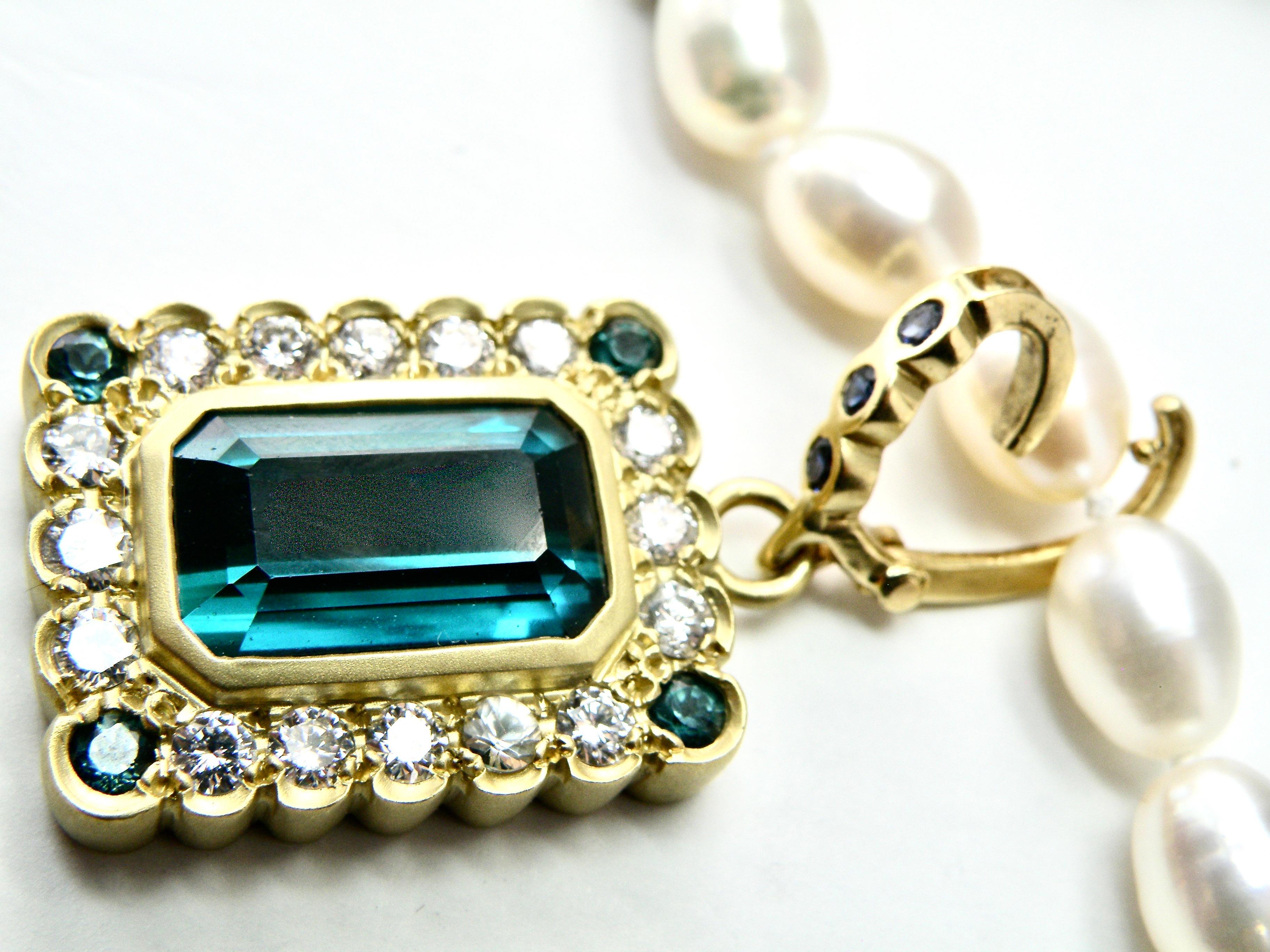 18K with diamonds surrounding magnificient green afghan tourmaline pendant