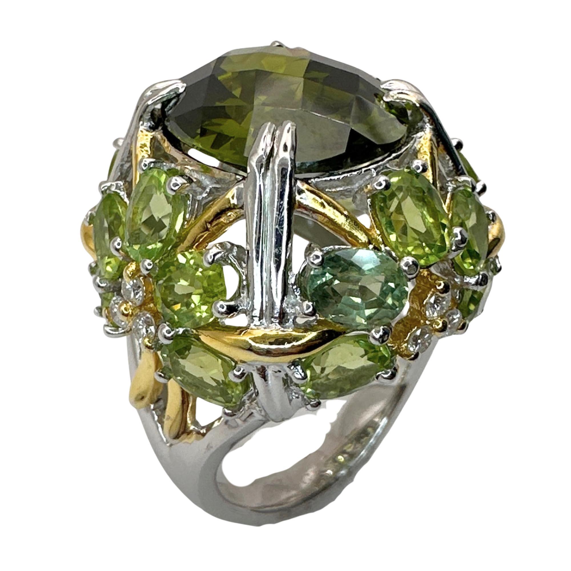 Indulge in luxury with our 18k Diamond and Green Stone Center Cocktail Ring. Crafted with 18k white and yellow gold and adorned with stunning 0.33 carats of diamonds and 22.42 carats of green stones, this ring exudes elegance and sophistication.
