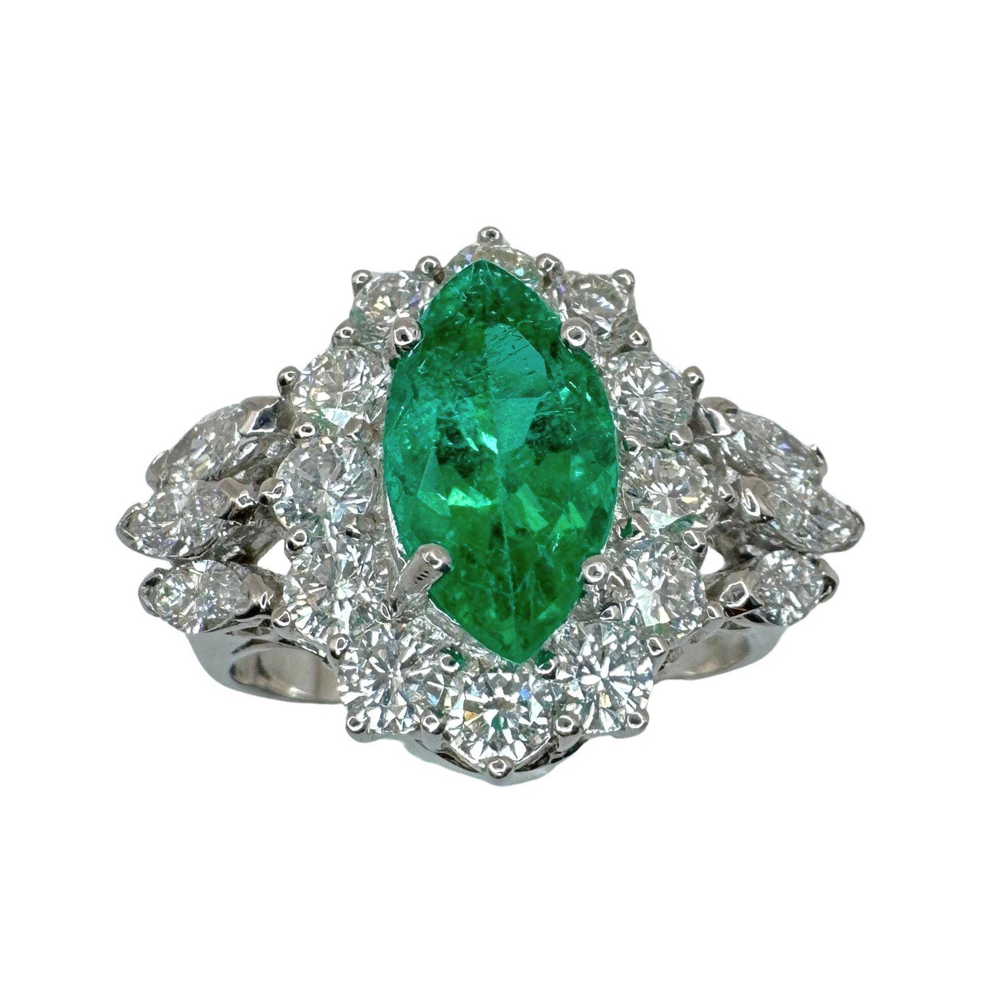 Indulge in luxury with this 18k Diamond and Emerald Ring. Crafted in 18k white gold and adorned with stunning 1.33 carats of diamonds surrounding a beautiful 1.60 carat emerald, this ring exudes elegance and sophistication. In good condition with