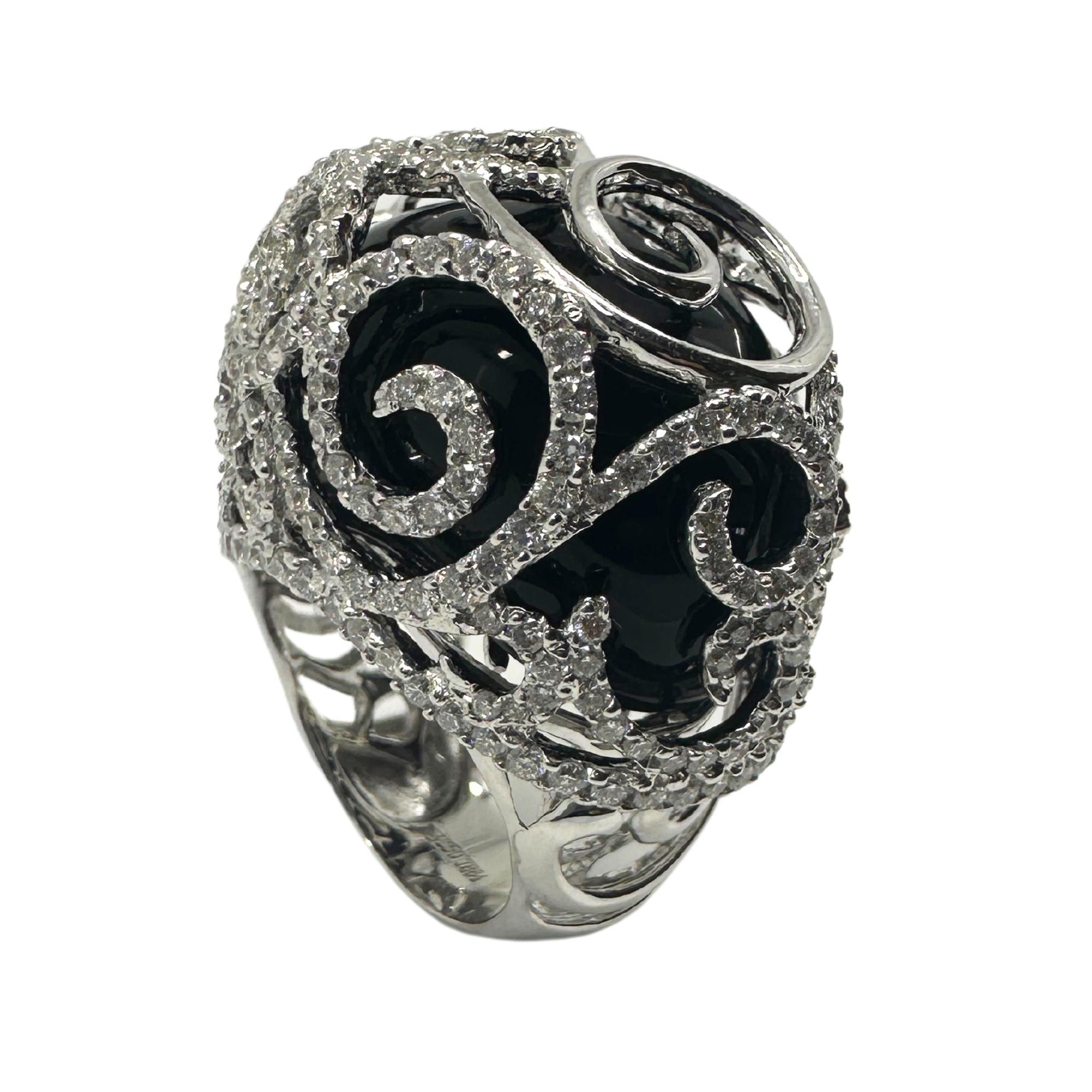 Indulge in luxury with our 18k Diamond and Onyx Cocktail Ring. Made from 18k white gold and adorned with 2.97 carats of sparkling diamonds and 63.04 carats of rich onyx. In good condition with minimal surface wear, this statement piece weighs 23.9