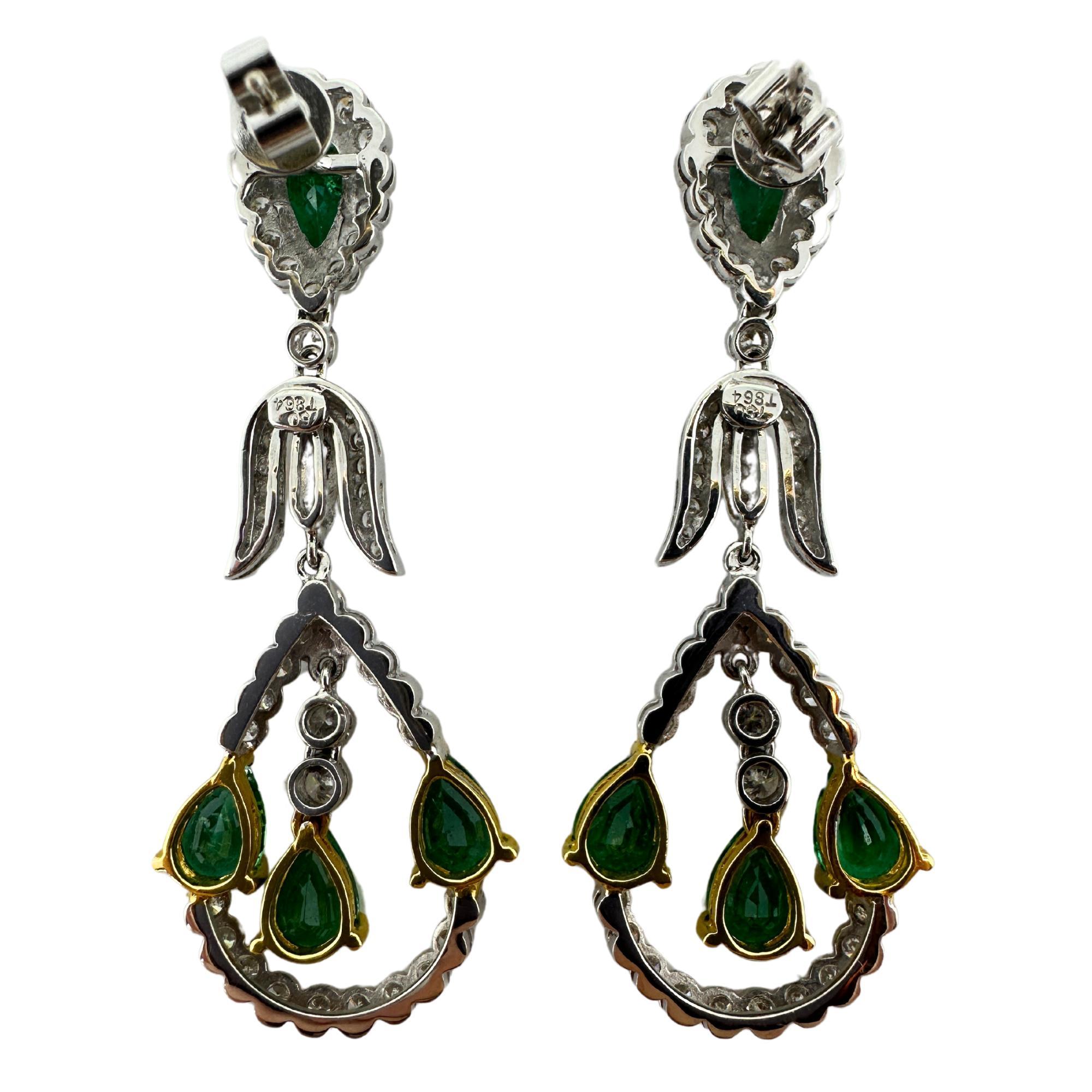 18K Diamond and Pear Shaped Emerald Earrings
Condition: In good condition with some minor surface wear consistent with age.
Length: 2 inches long
Width: 0.75 inches
Metal: 18k White Gold
Weight: 9.94 grams
Diamonds: 1.73 carats
Emerald: 4.86 carats