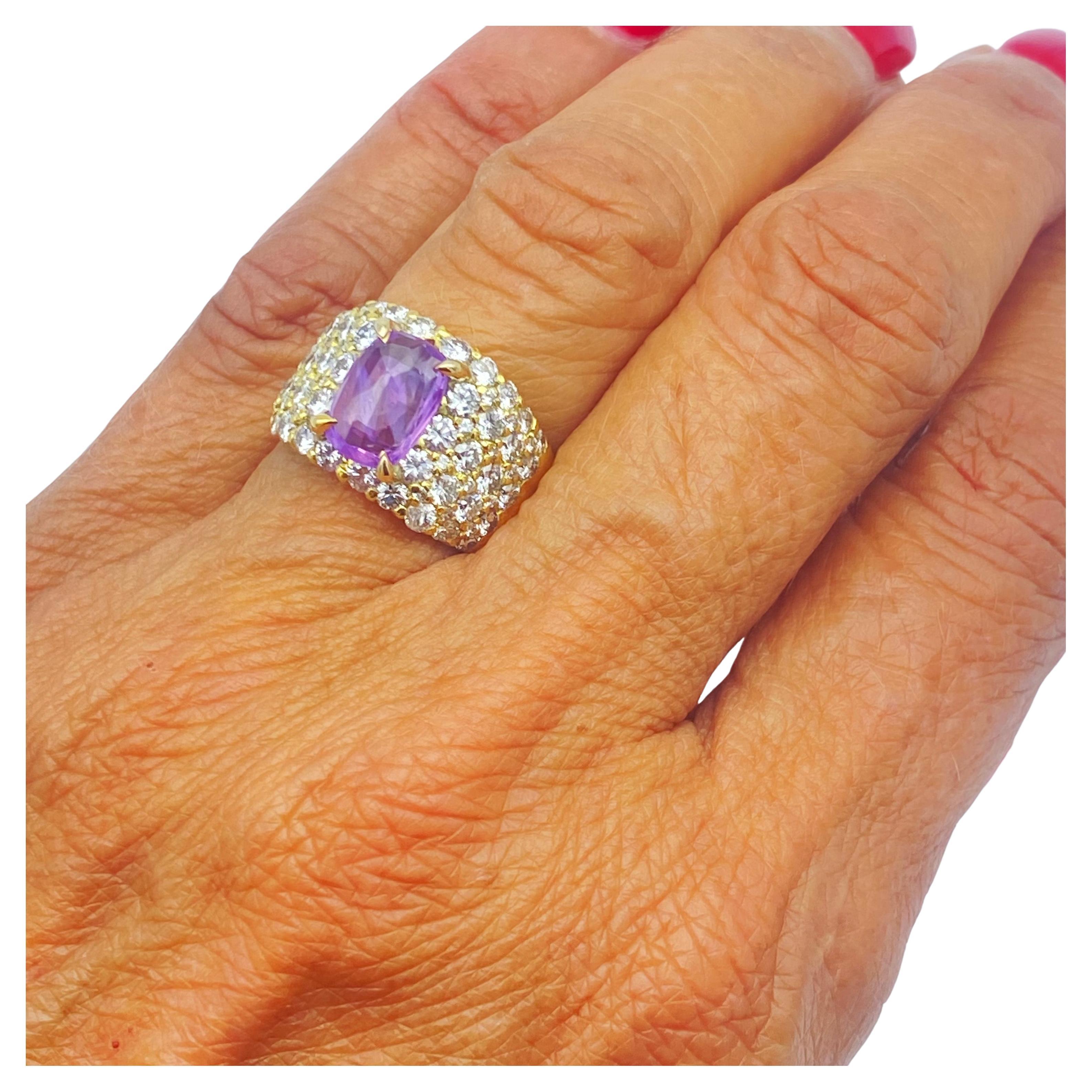 Stunning quality and style with this vast, dome-shaped Pink Sapphire and Diamond ring.
The rings center Pink Sapphire measures a 10.86mm x 7.04mm gemstone and is a natural, untreated gemstone. The weight of the sapphire is 2.47 carats. The cut is an