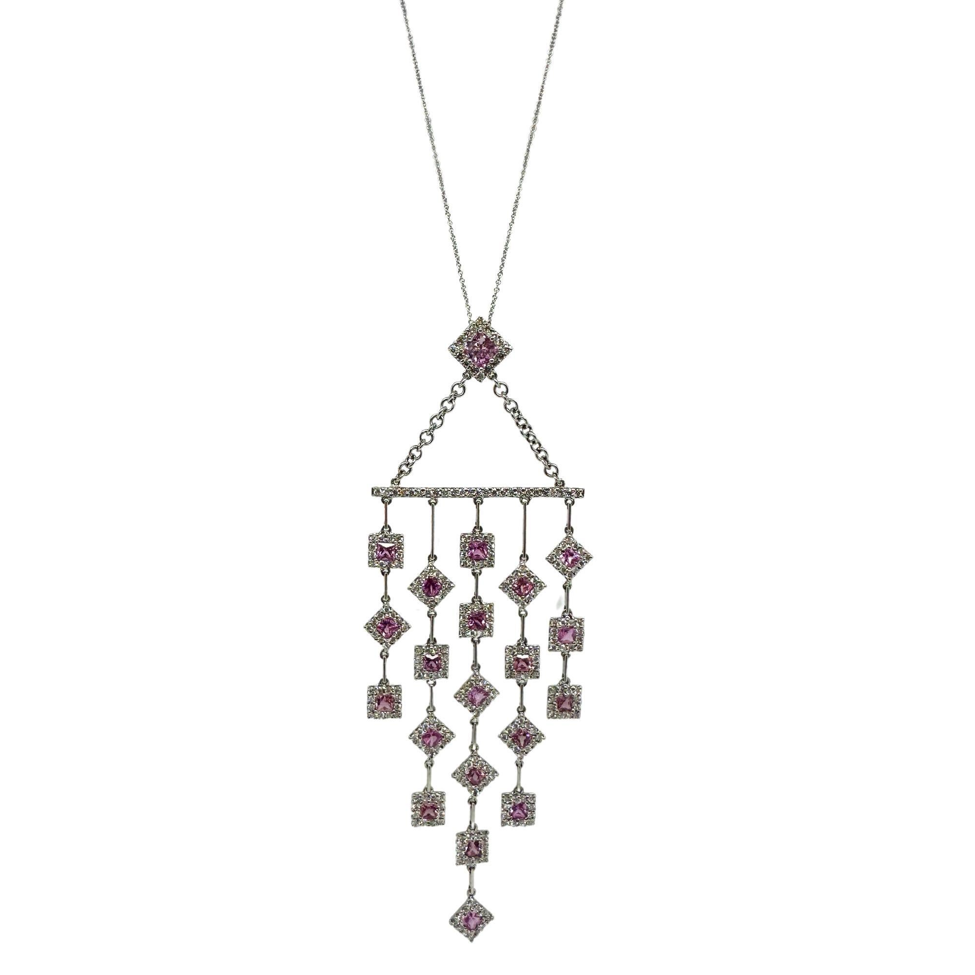 Elevate any outfit with this stunning 18k Diamond and Pink Sapphire Necklace. Crafted in 18k white gold, the necklace features a 4.25 inch pendant adorned with 2.44 carats of sparkling diamonds and 3.43 carats of pink sapphire. With a weight of 13.6