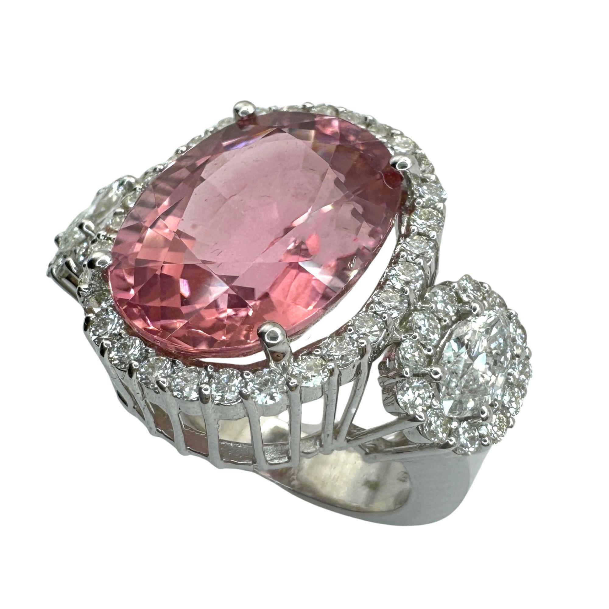 Indulge in luxury with this 18k white gold ring adorned with stunning 1.60 carat diamonds and a striking 10.82 carat pink stone center. The intricate details and 13.20 gram weight make this piece a true statement of elegance and sophistication.