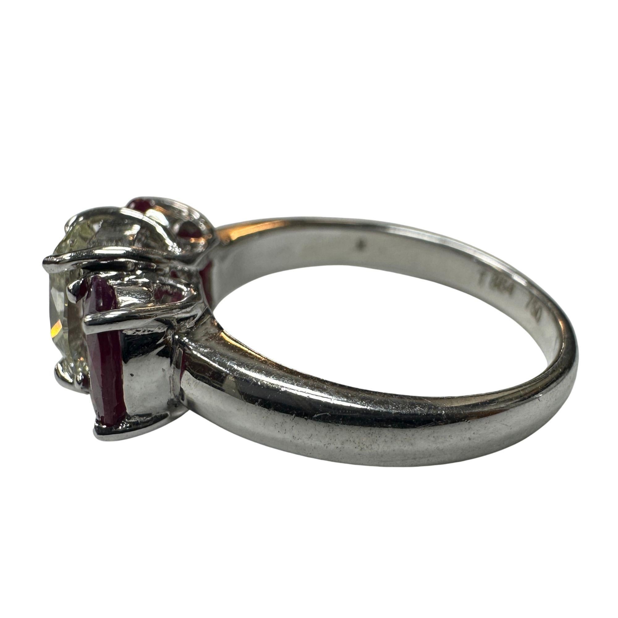 Discover the allure of vintage sophistication with this 18k Diamond and Ruby Ring, presented in very good condition with minor surface wear, a testament to its rich history.

Crafted in 18k white gold and weighing 5.7 grams, this ring is a true