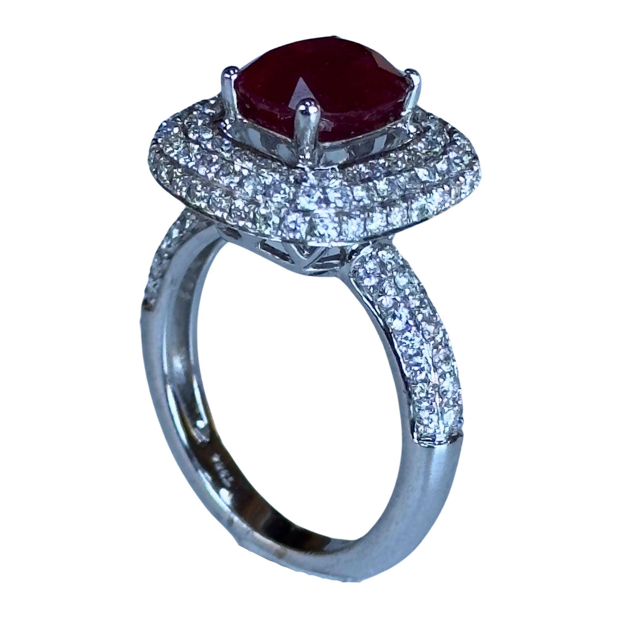 This elegant 18k diamond and ruby ring showcases a total of 1.06 carats of diamonds and 3.19 carats of rubies in a stunning 18k white gold setting. In good condition with minor surface wear, this 7.6 gram ring is marked with 