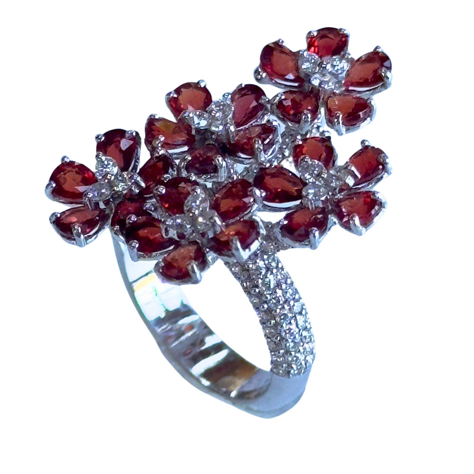 This dainty and dazzling 18k Diamond and Ruby Floral Ring is sure to make a statement on your finger! Crafted with 18k white gold and adorned with 1.35 carats of sparkling diamonds and 5.17 carats of rubies, this ring is truly unique. Ring size 6.5
