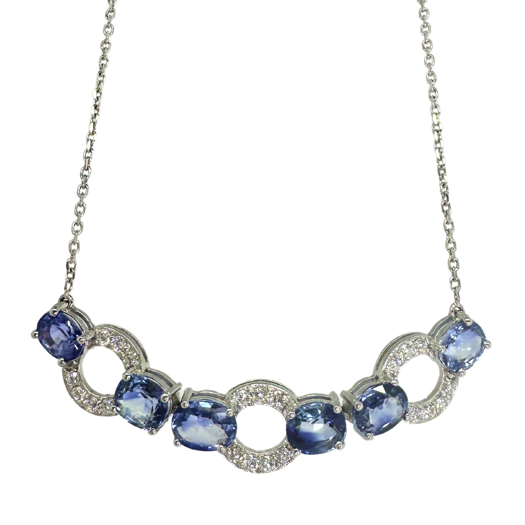 This 18K Sapphire and Diamond Necklace is an exquisite piece. Crafted from high-quality 18k white gold, it features 6.94 carats of blue sapphires that create a striking visual impact. Accentuated by 0.54 carats of white diamonds, the necklace