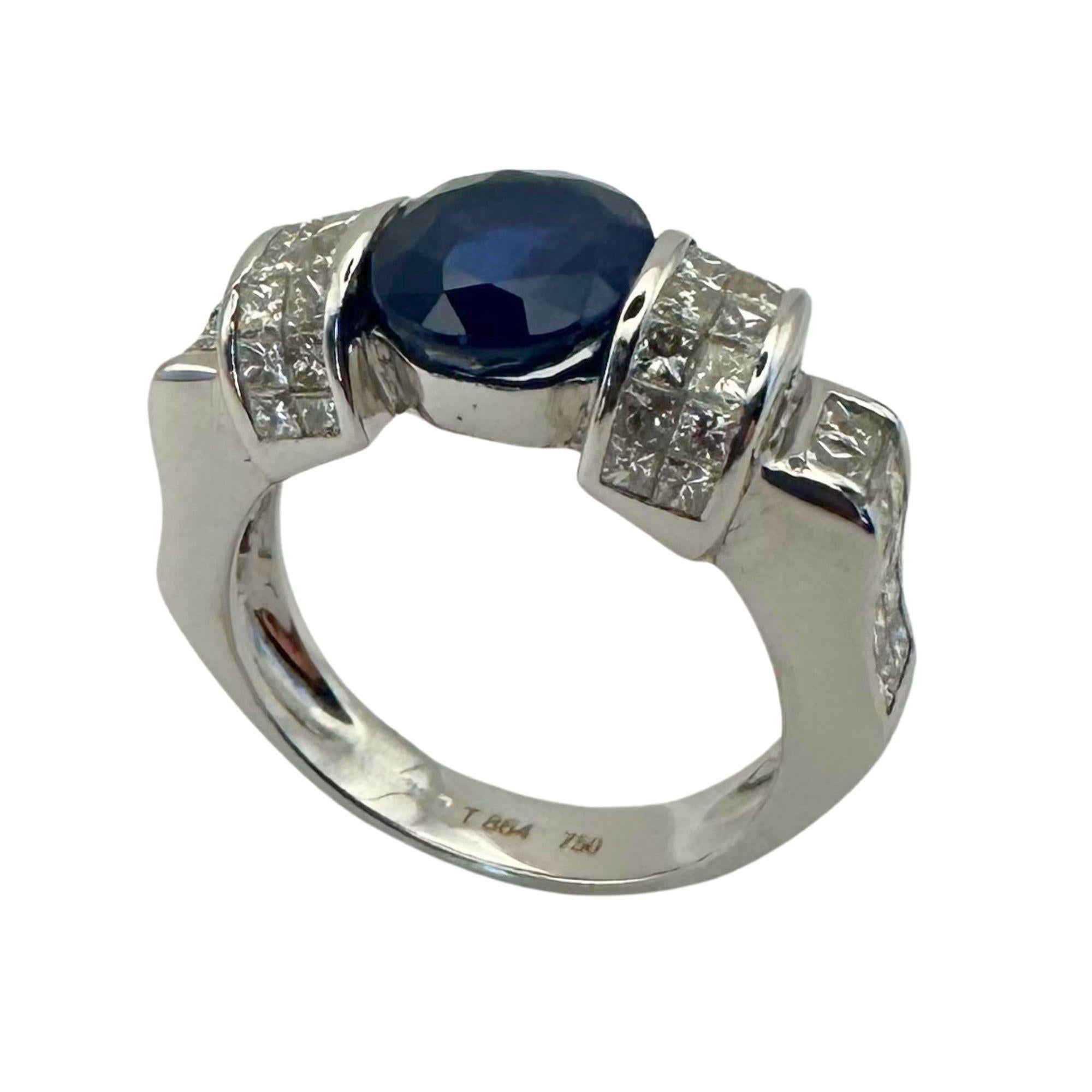 Crafted with precision and elegance, this 18k Diamond and Sapphire Ring boasts a stunning 3.32 carat sapphire at its center. Adorned with 1.94 carats of sparkling diamonds, this 5.4 gram white gold ring is a luxurious addition to any collection.
