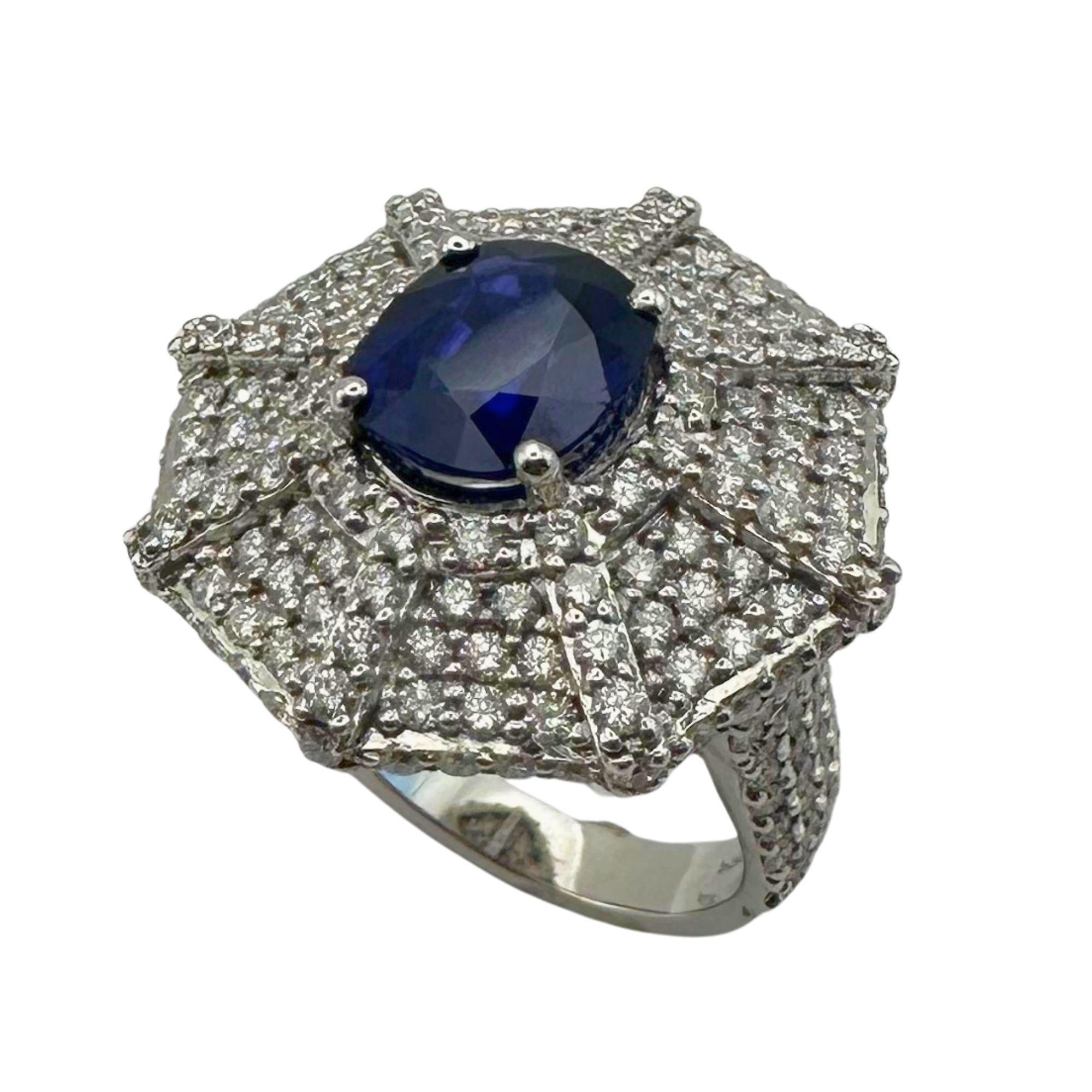 This 18k diamond and sapphire ring is a stunning piece of jewelry. The 3.05 carat sapphire center is surrounded by 3.34 carats of sparkling diamonds, making for a total weight of 10.8 grams. Its size 6.25 ensures a perfect fit. Elevate any outfit