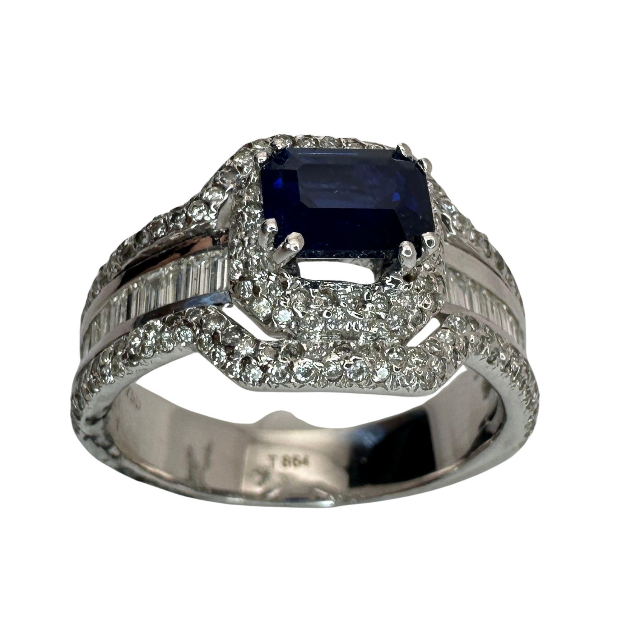 Elevate your style with our 18k Diamond and Sapphire Ring. The 1.57 carat sapphire center stone is surrounded by a sparkling halo of 0.60 carat diamond accents, accented by elegant baguette cut diamonds. With a weight of 11.19 grams and a size 8.5