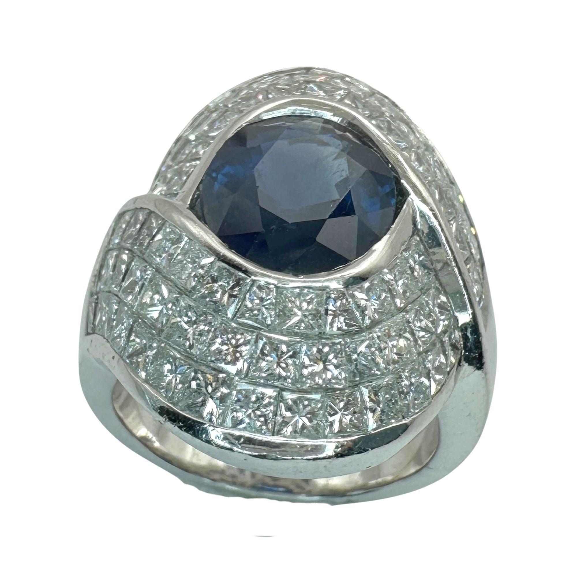 Expertly crafted, this 18k Diamond and Sapphire Ring showcases a stunning 4.40 carat center sapphire surrounded by 5.10 carats of sparkling diamonds. Made with 18k white gold and weighing 16.2 grams, this ring is a perfect balance of elegance and