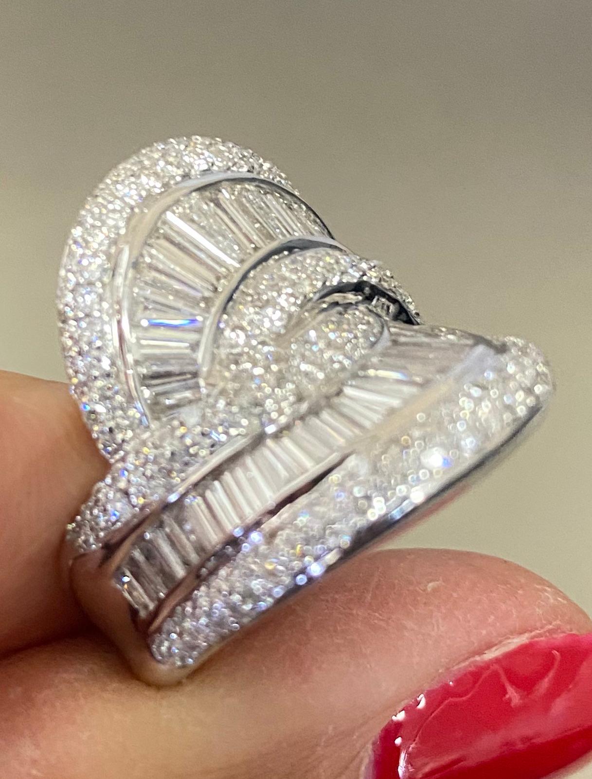 Lady's 18k Diamond Baguette Diamond Cocktail Ring 3.73 Carats
The diamond cocktail ring is a statement that expands 1 inch in length. The edges fold upward, giving an exciting contour for the call to showcase the diamonds. The width of the ring is 1