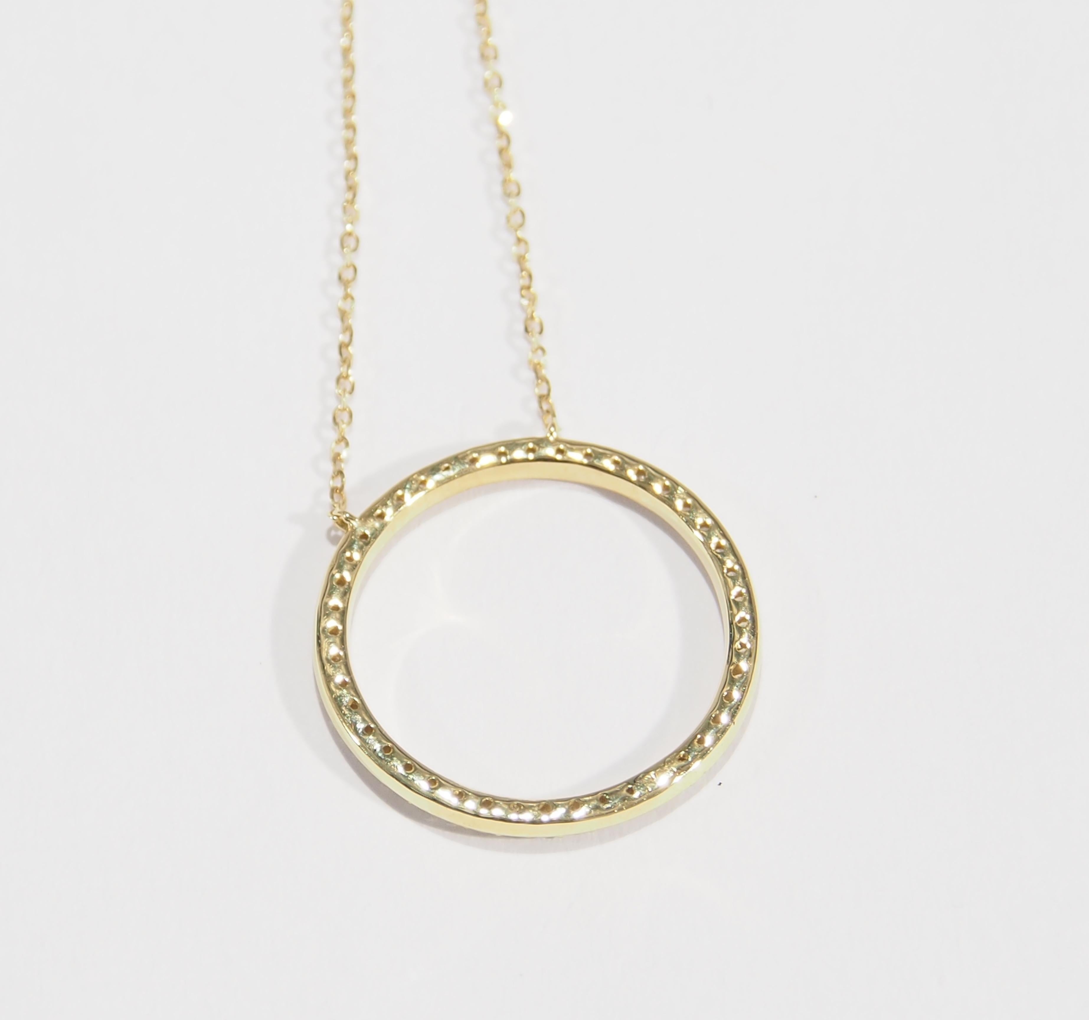 This is a delightful 18K Yellow Gold Necklace featuring a sparkling Diamond Circle. The 3/4 of an Inch Diameter Circle contains approximately 0.43ctw of Round Brilliant Cut Diamonds, G-H in Color, VS-SI in Clarity and is suspended from an adjustable