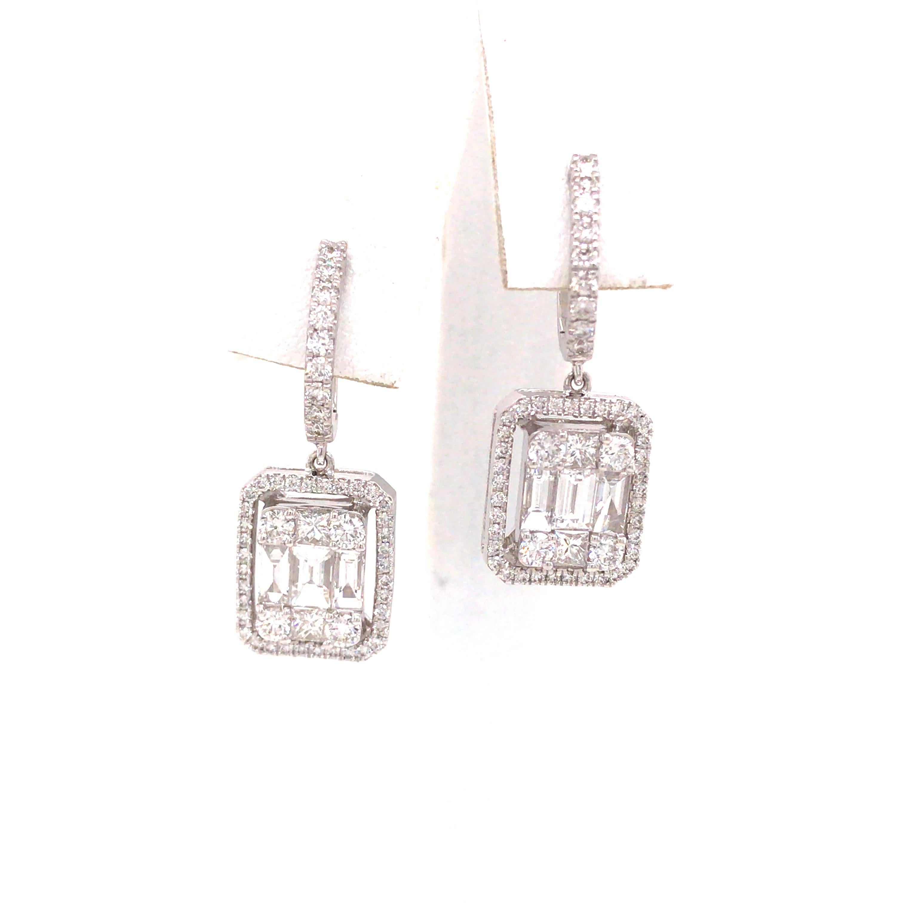 Diamond Cluster Dangle Earring in 18K White Gold.  Princess Cut, Baguette and Round Brilliant Cut Diamonds weighing 2.18 carat total weight, G-H in color and VS in clarity are expertly set.  The Earrings measure 1 1/8 inch in length and 1/2 inch in