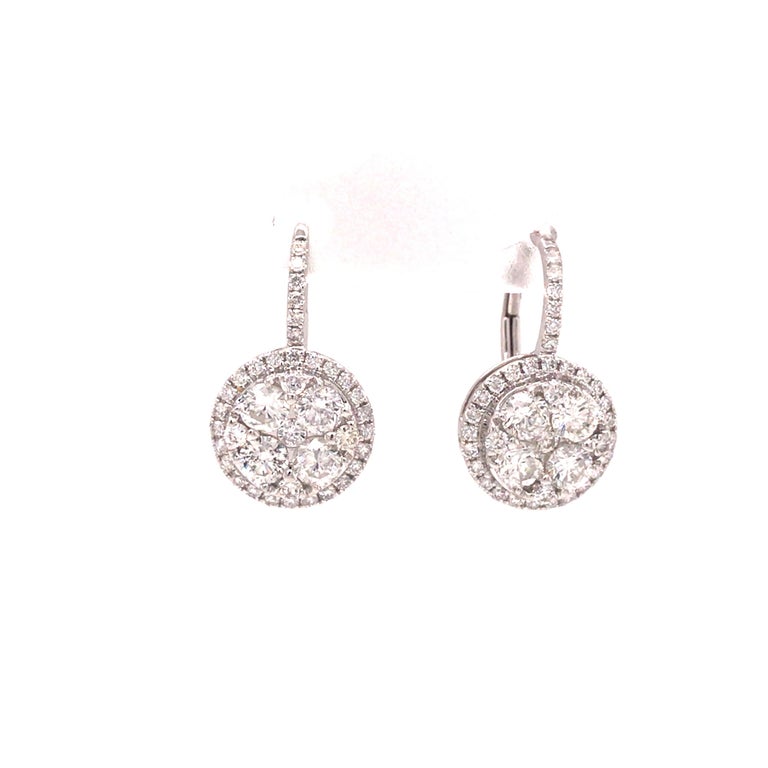 Diamond Cluster Drop Earring in 18K White Gold.  Round Brilliant Cut Diamonds weighing 1.75 carat total weight, G-H in color and VS-SI in clarity are expertly set.  The earrings measure 3/4 inch in length and 7/16 inch in width at the widest point. 