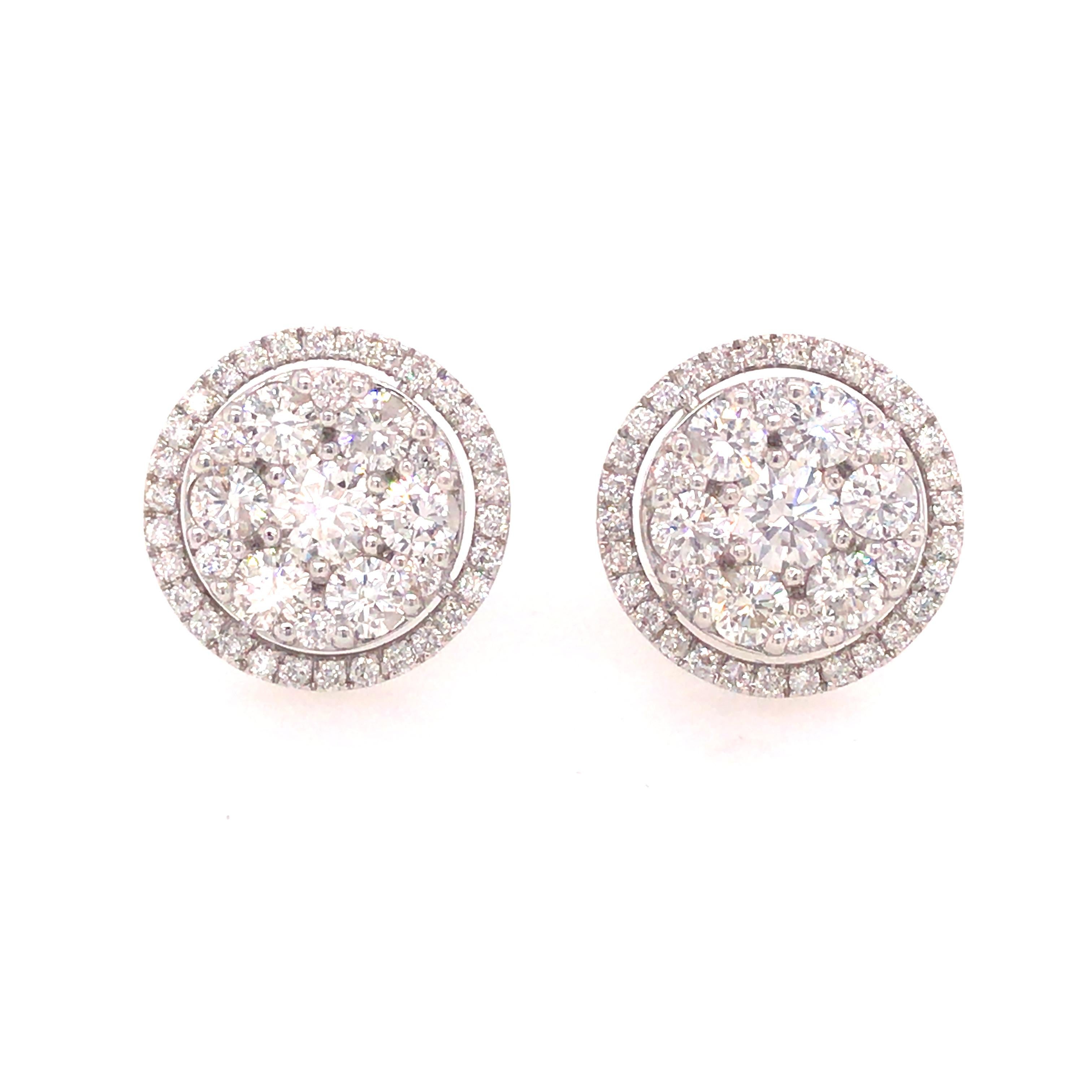 Diamond Cluster Earrings in 18K White Gold.  (86) Round Brilliant Cut Diamonds weighing 2.51 carat total weight, G-H in color and VS-SI in clarity are expertly set.  The Earrings measure 1/2 inch in diameter.  5.88 grams.