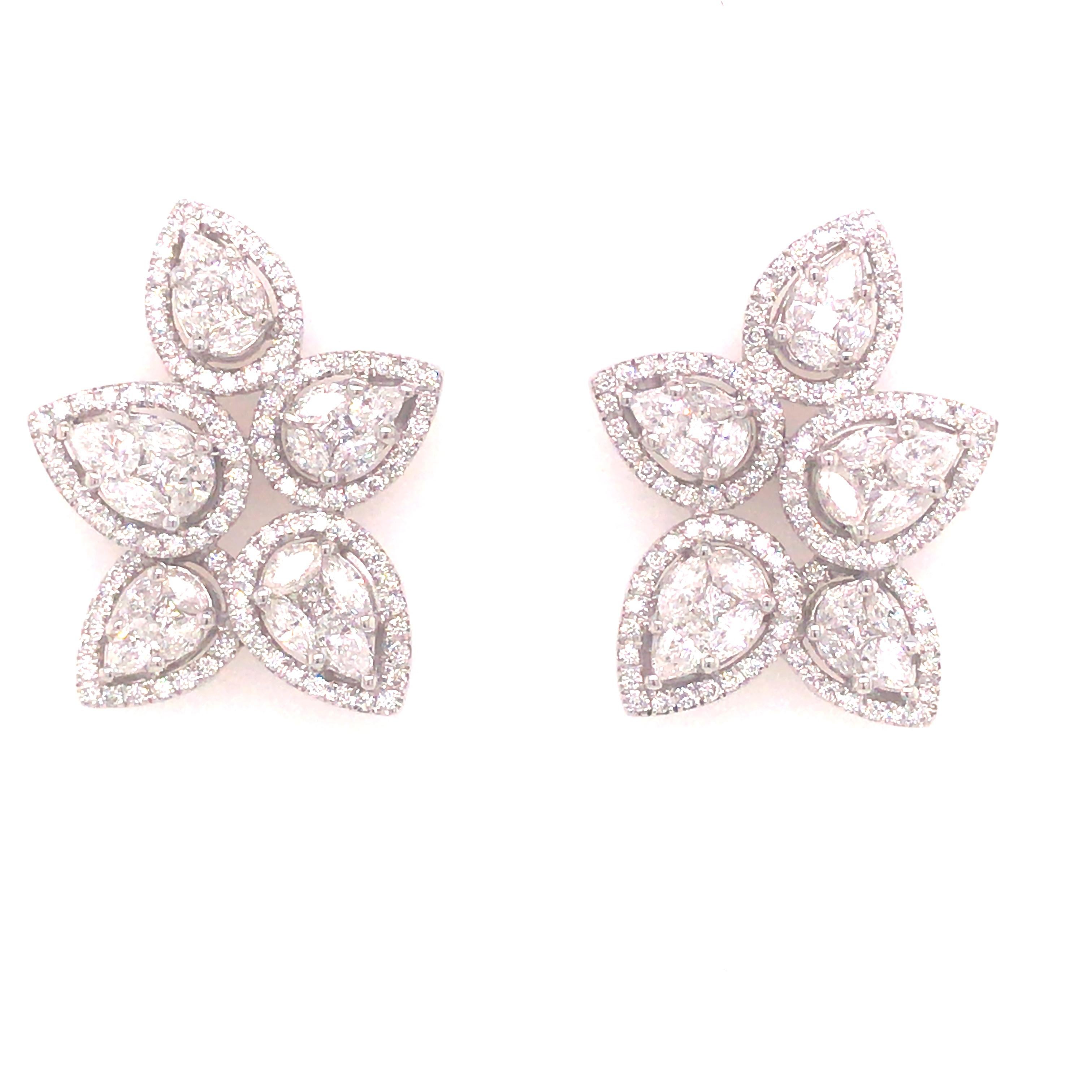 Diamond Cluster Flower Petal Earrings in 18K White Gold. Round Brilliant Cut, Princess Cut and Marquise Diamonds weighing approximately 2.55 carat total weight, G-H in color and VS in clarity are expertly set. The Earrings measure 1 inch in length