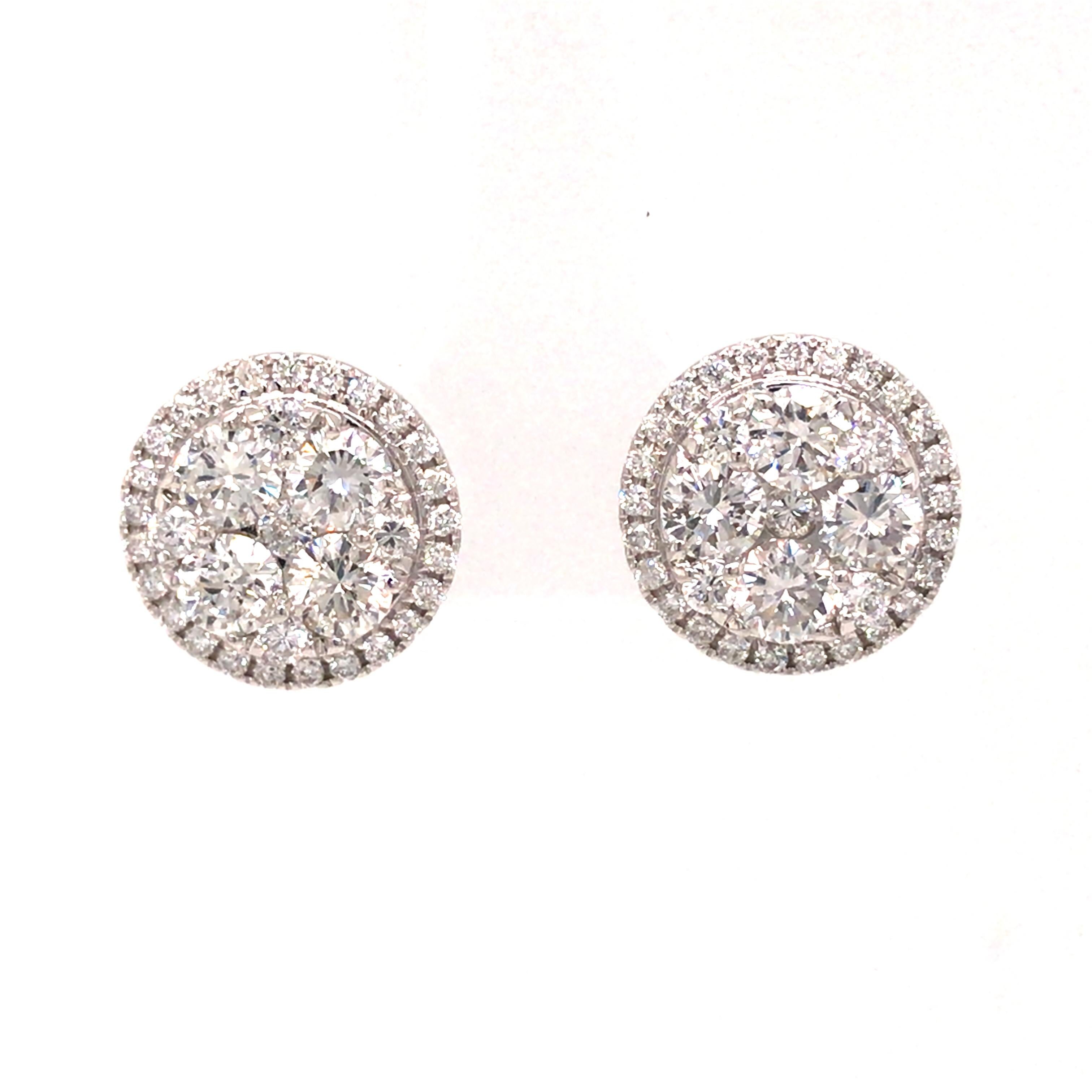 Diamond Cluster Studs in 18K White Gold.  Round Brilliant Cut Diamonds weighing 2.04 carat total weight, G-H in color and VS-SI in clarity are expertly set.  The Earrings measure 1/2 inch in diameter. 4.66 grams.