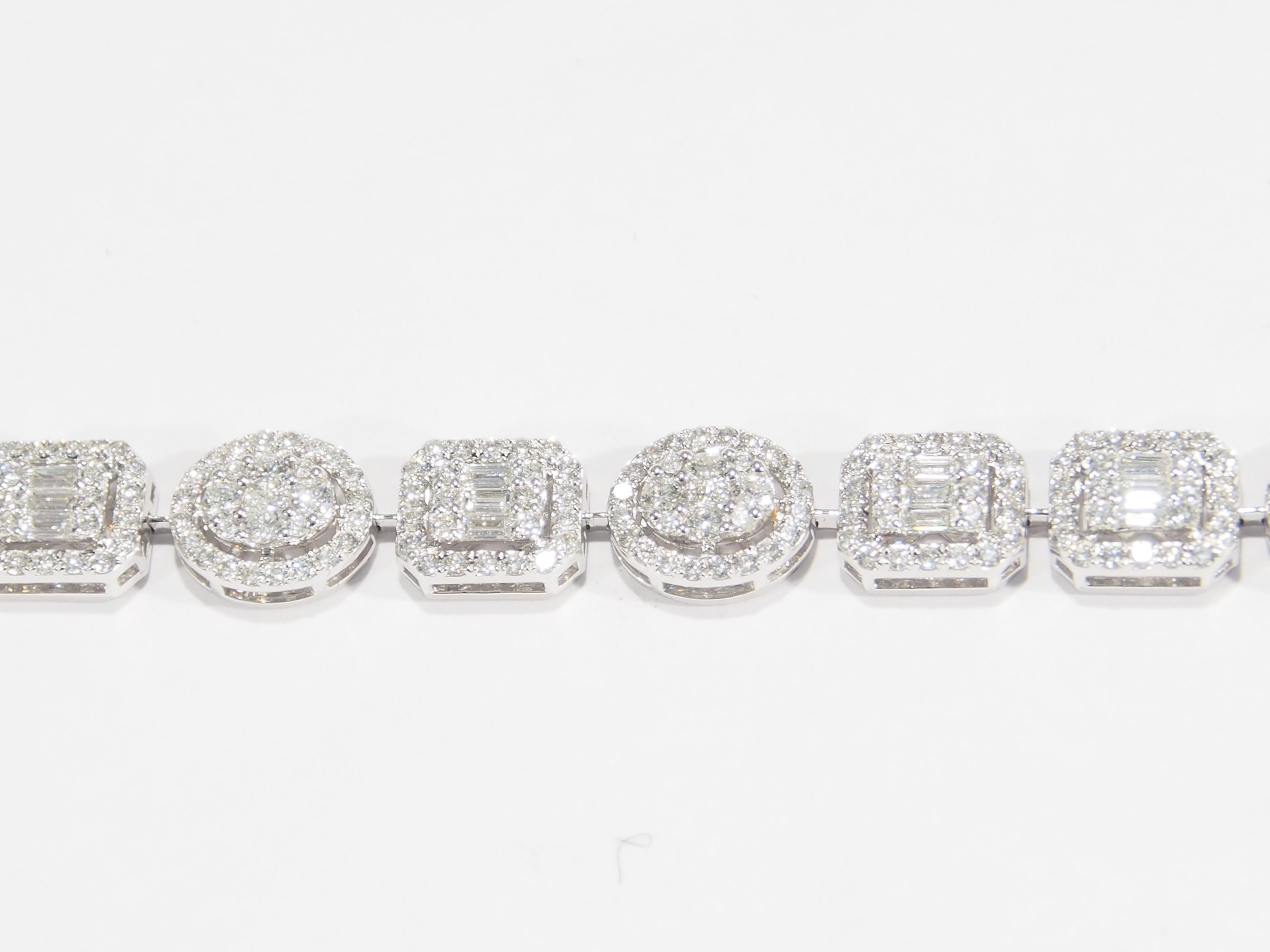 A beautiful bracelet set with 444 Round Brilliant Cut Diamonds 33 Baguette Diamonds G-H in color VS-SI, in clarity and approximately 4.12 total weight. Expertly set in 18K white gold weighing 14.08 grams. 6.7 inches long, 1/4 inch wide.

